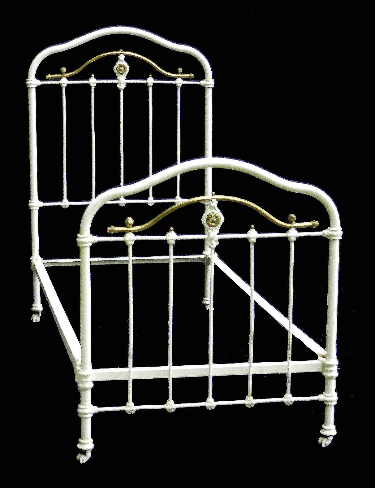 French iron and brass single bed, circa 1890
With brass ring details 
On original castors
This bed will take a 3 foot 6 inch or 45 inch wide mattress on either a slatted wood base (included) or a box base (not included) please ask for more info