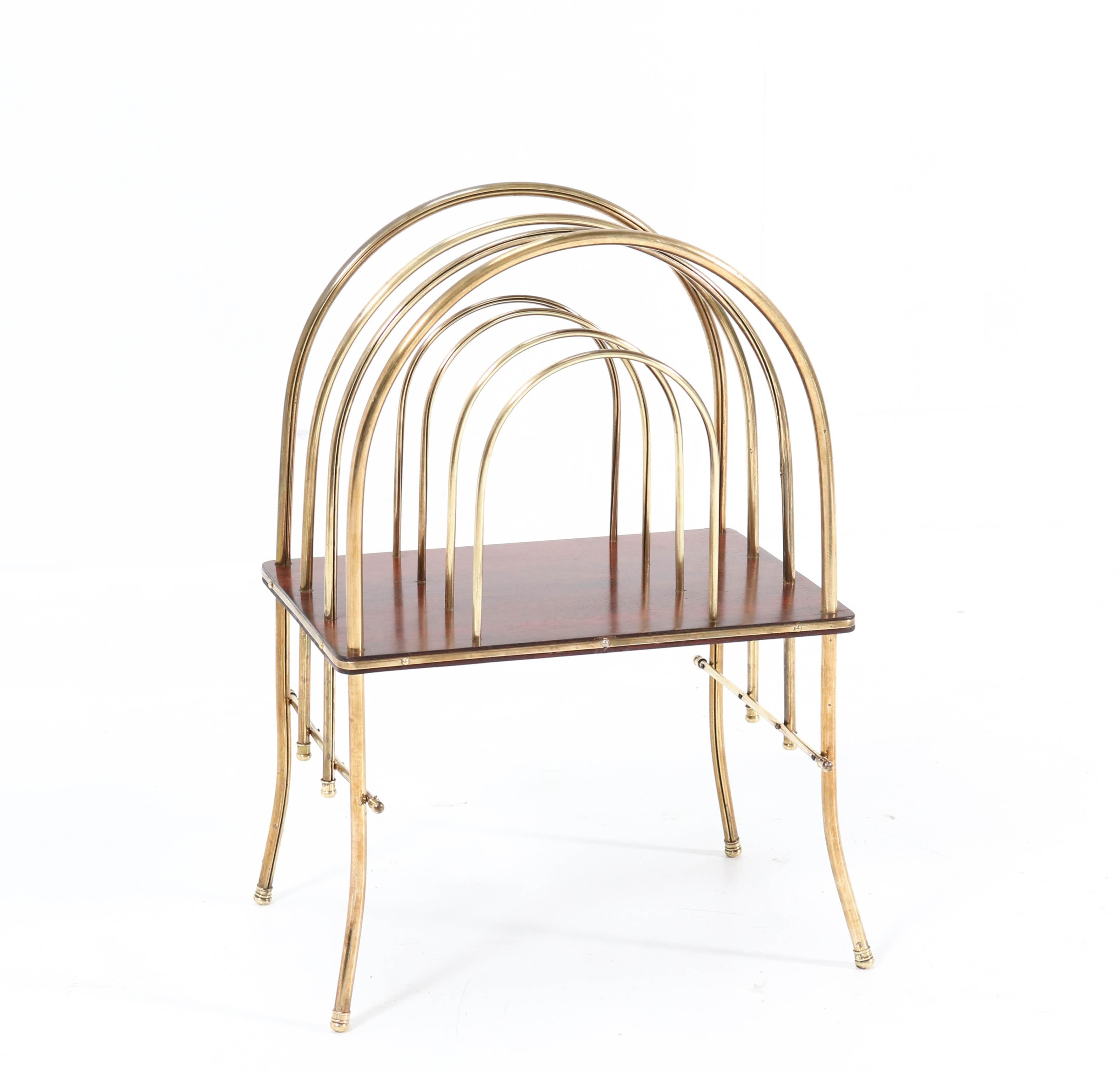 Wonderful Art Nouveau magazine rack.
Striking French design from the 1900s.
This stunning piece of furniture is manufactured in brass and mahogany.
In very good condition with a beautiful patina.