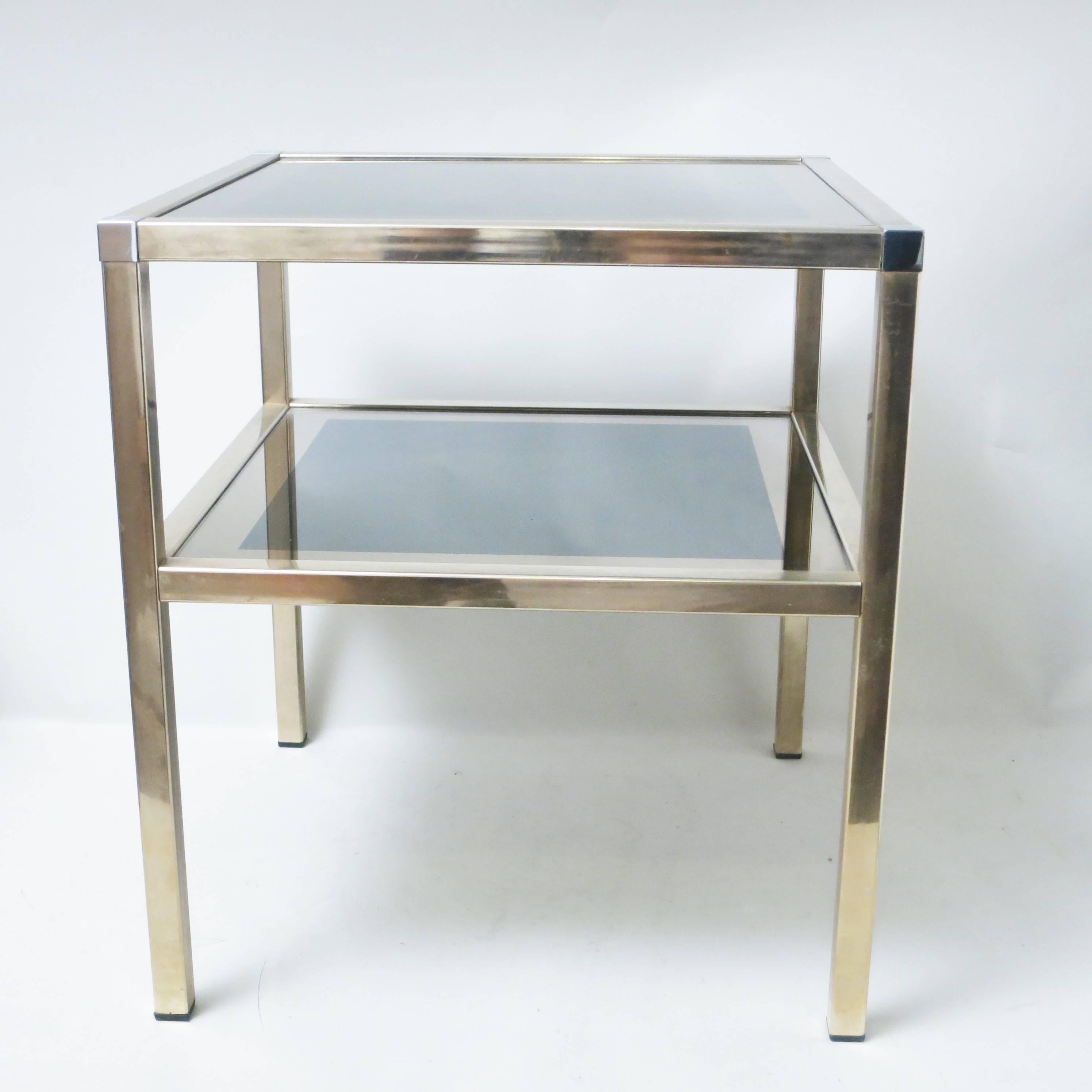 French Mid-Century Modern double level side table in brass, chrome and mirror by Maison Charly Frères in Bordeaux France and in the style on Guy Lefebre for Jansen or Pierre Vandel.