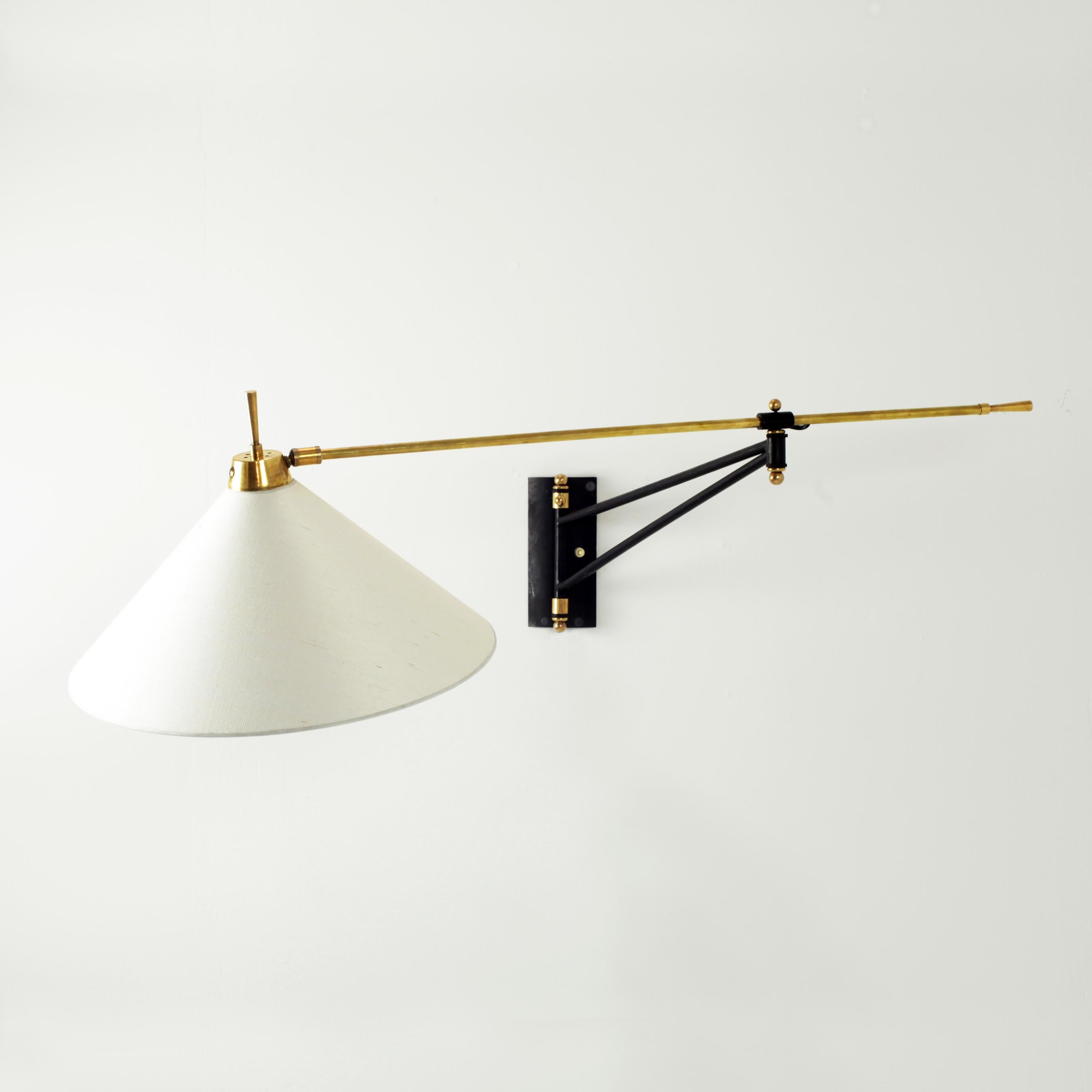 Big French wall lamp from the 1950s with swing arm, black steel and brass detail, new handmade lampshades in Japanese paper.
The lamp uses French bayonet bulb (B22).
Measures: Total length 136 cm
Shade: height 35 cm, diameter 45 cm.