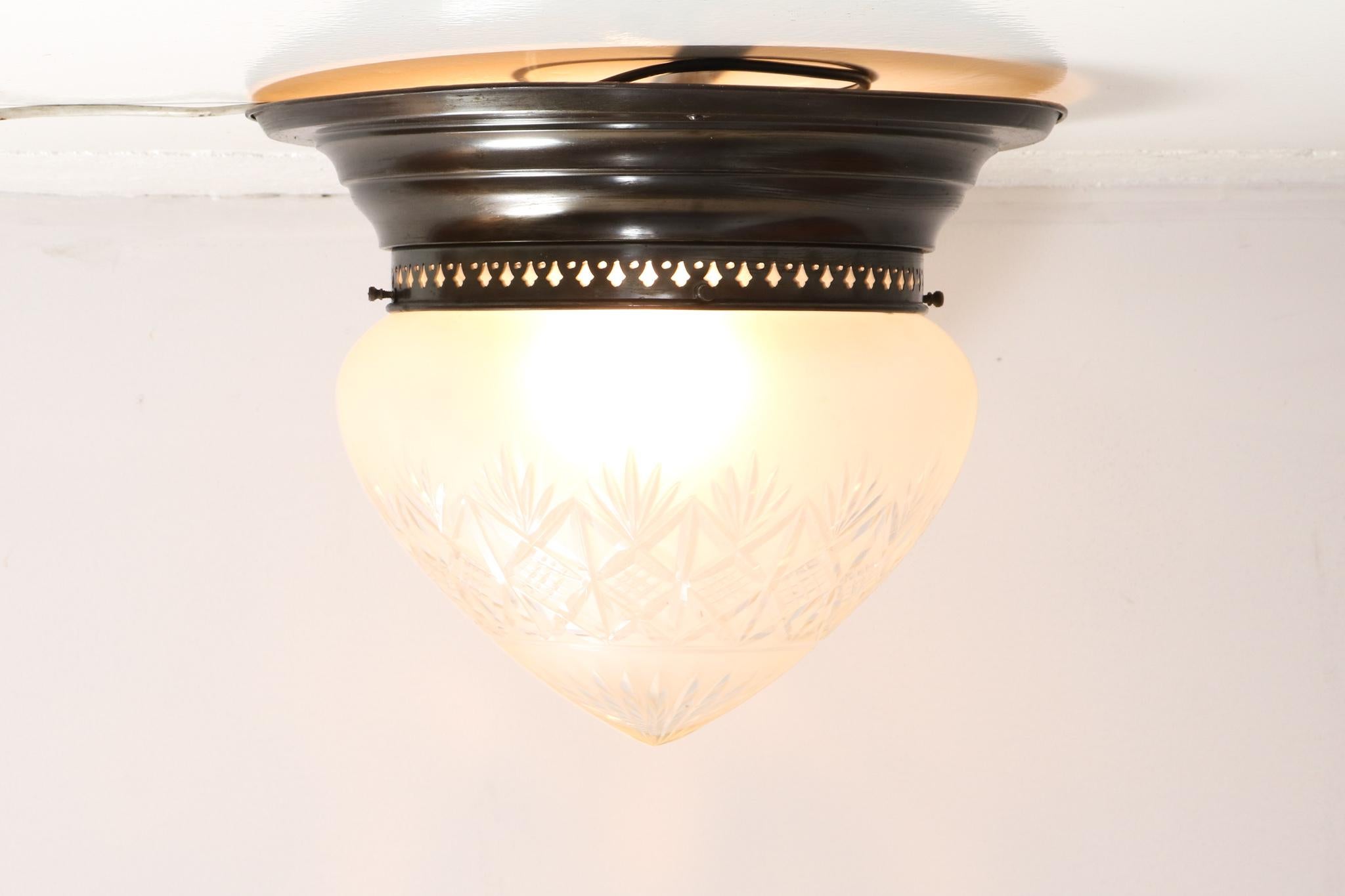 Magnificent French Art Nouveau brass cut blown glass flush mount large ceiling light.
Original shade and in very good condition with minor wear consistent with age and use, preserving a beautiful patina.
This wonderful Art Nouveau ceiling light is