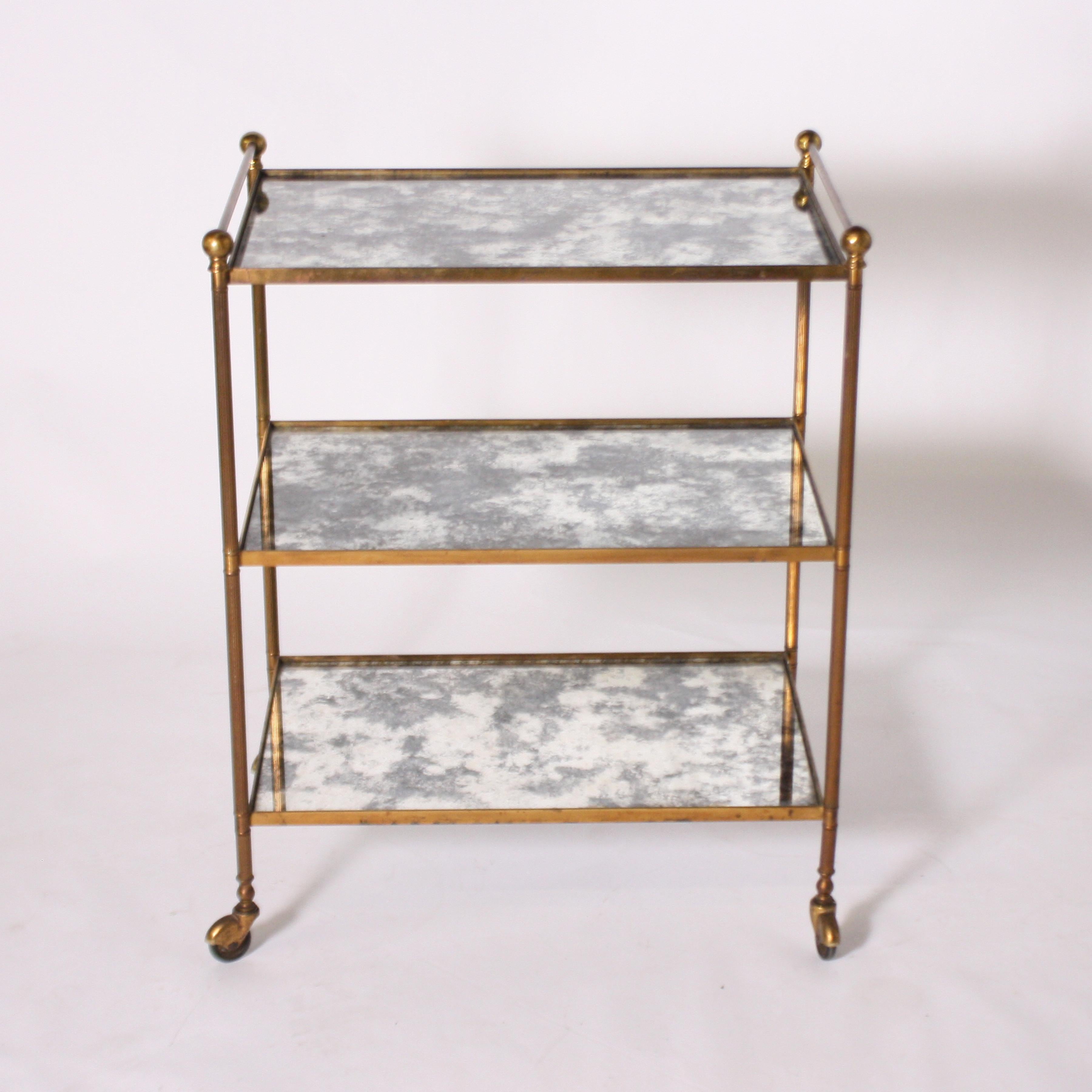 French brass bar cart with antique mirrored glass, circa 1960.