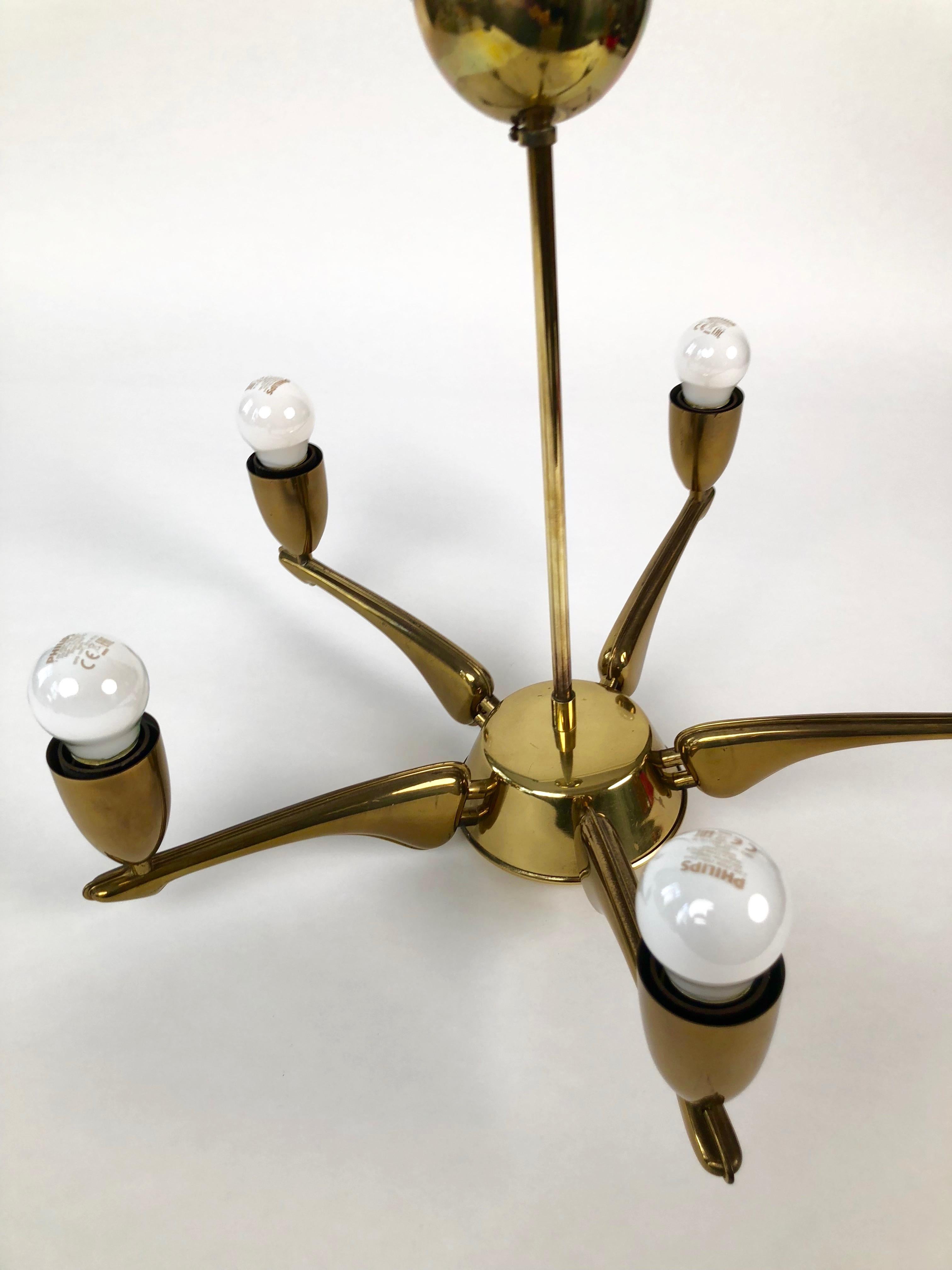 Brass chandelier from 1950s, made in France.
The lamp has 5 lights and has been newly rewired.