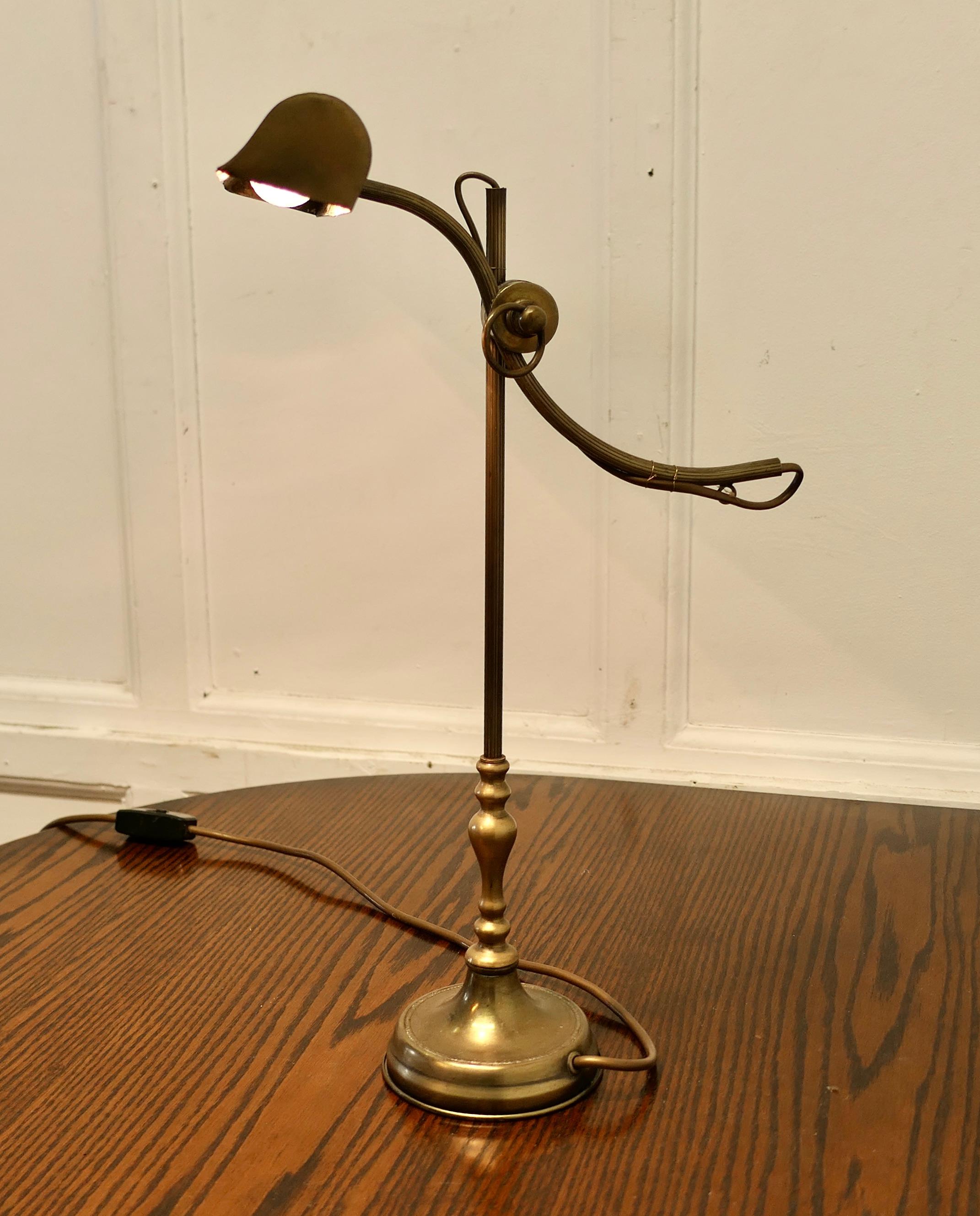 French Brass Desk Lamp with Long Brass Shade

This is a very attractive piece, the lamp has a central column which supports a swan neck brass arm which carries a long brass lamp

A very attractive piece the lamp is 20” tall and the arm is 12”
