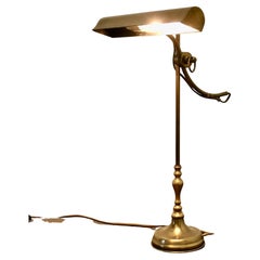 French Brass Desk Lamp with Long Brass Shade  This is a very attractive piece