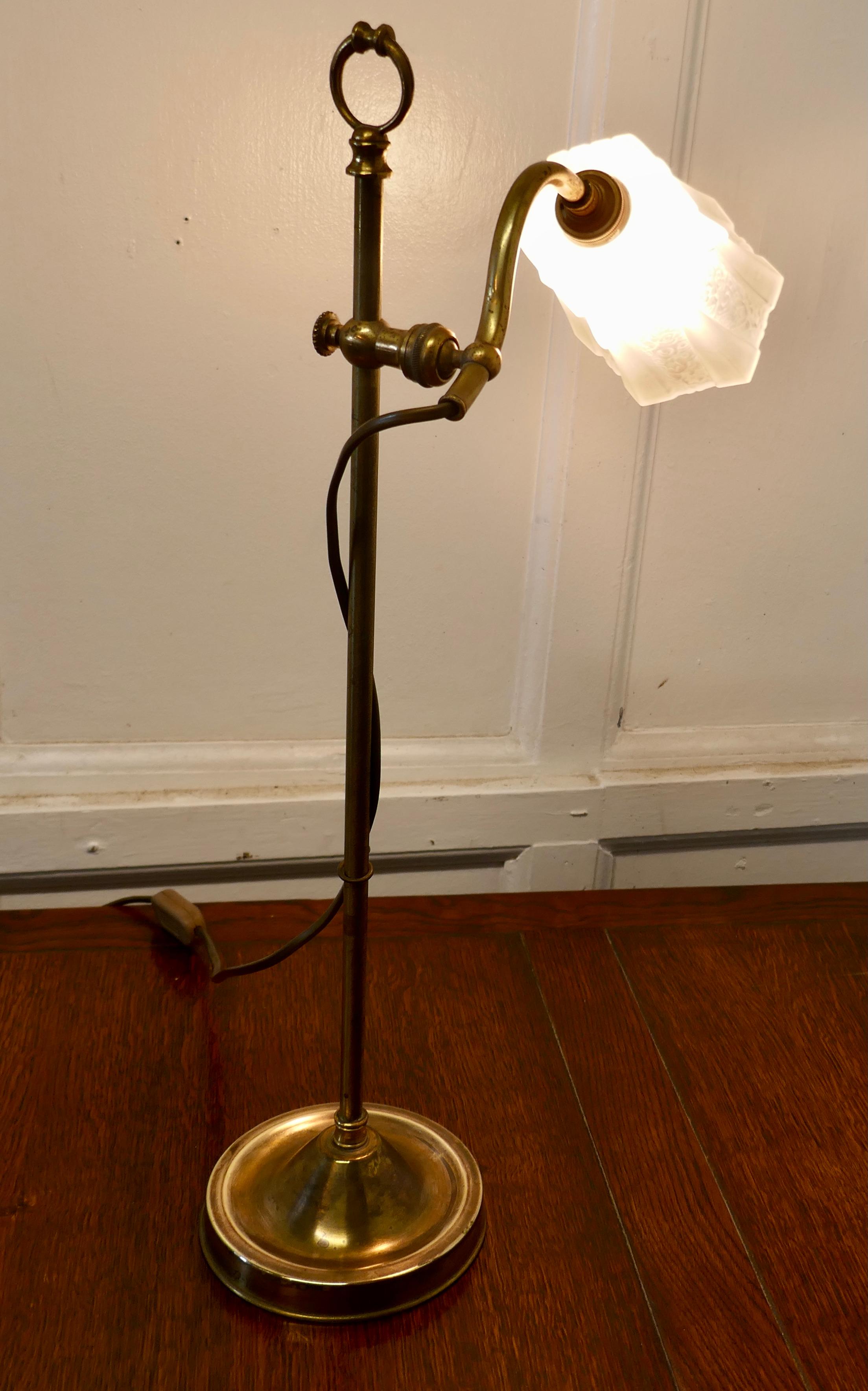 French brass desk lamp with opaline glass shade

This is a very attractive piece, the lamp has a central column which supports a swan neck arm, this can be raised, lowered and swivelled into different positions
The lamp comes with its original