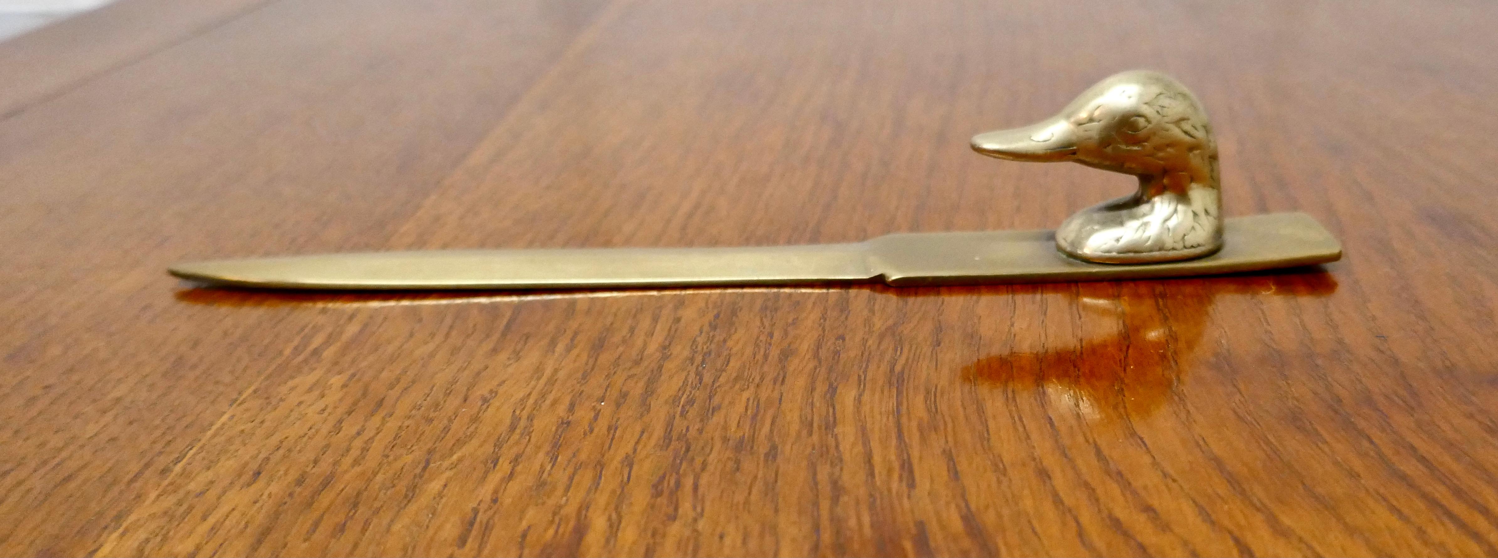 French brass duck’s head letter ppener, paper knife

A great desk piece, the knife sits neatly on your desk ready for use, all in solid brass and good condition
The knife is 2” high and 9” long
TNV97.