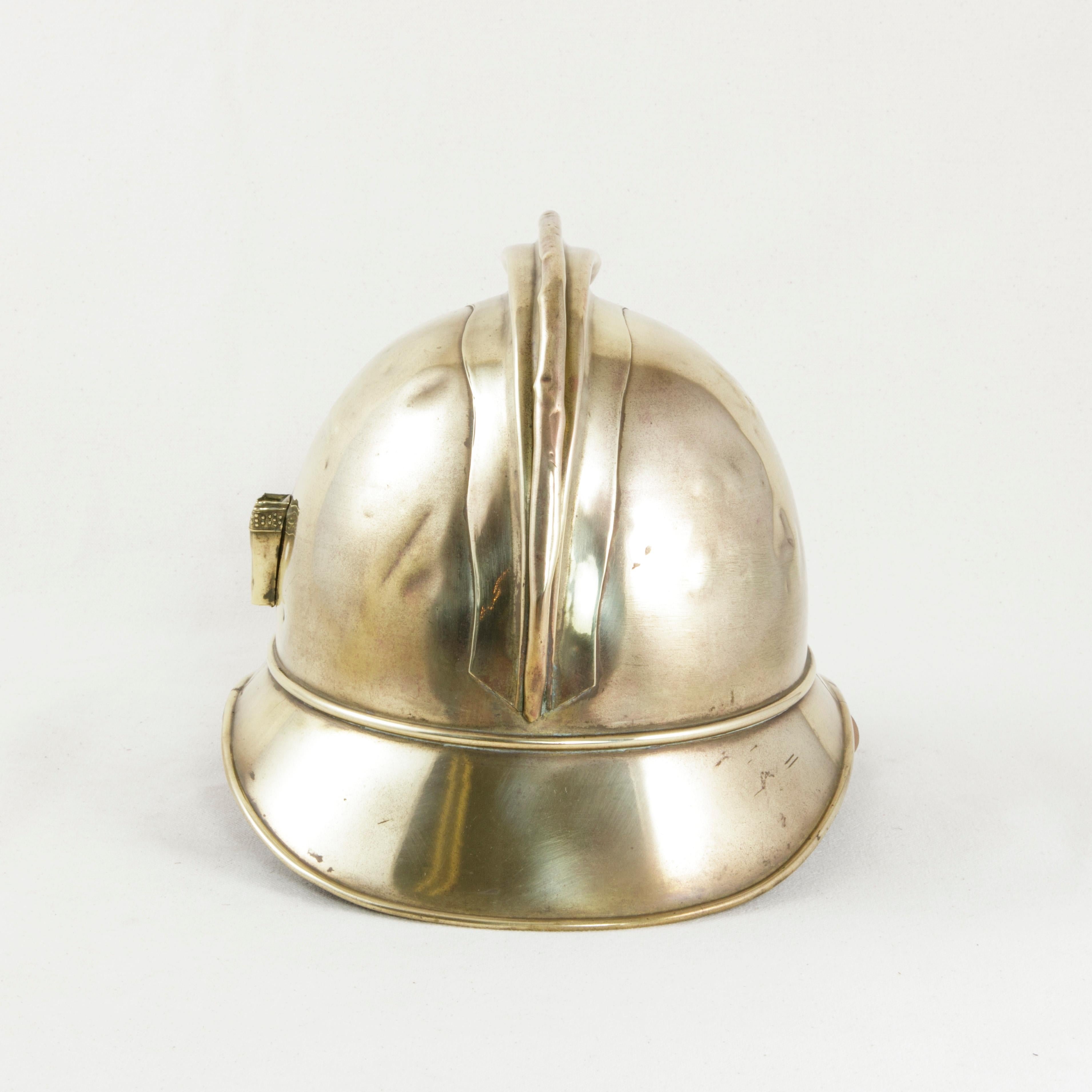 Early 20th Century French Brass Fireman's Helmet with City Seal and Leather Interior, circa 1900