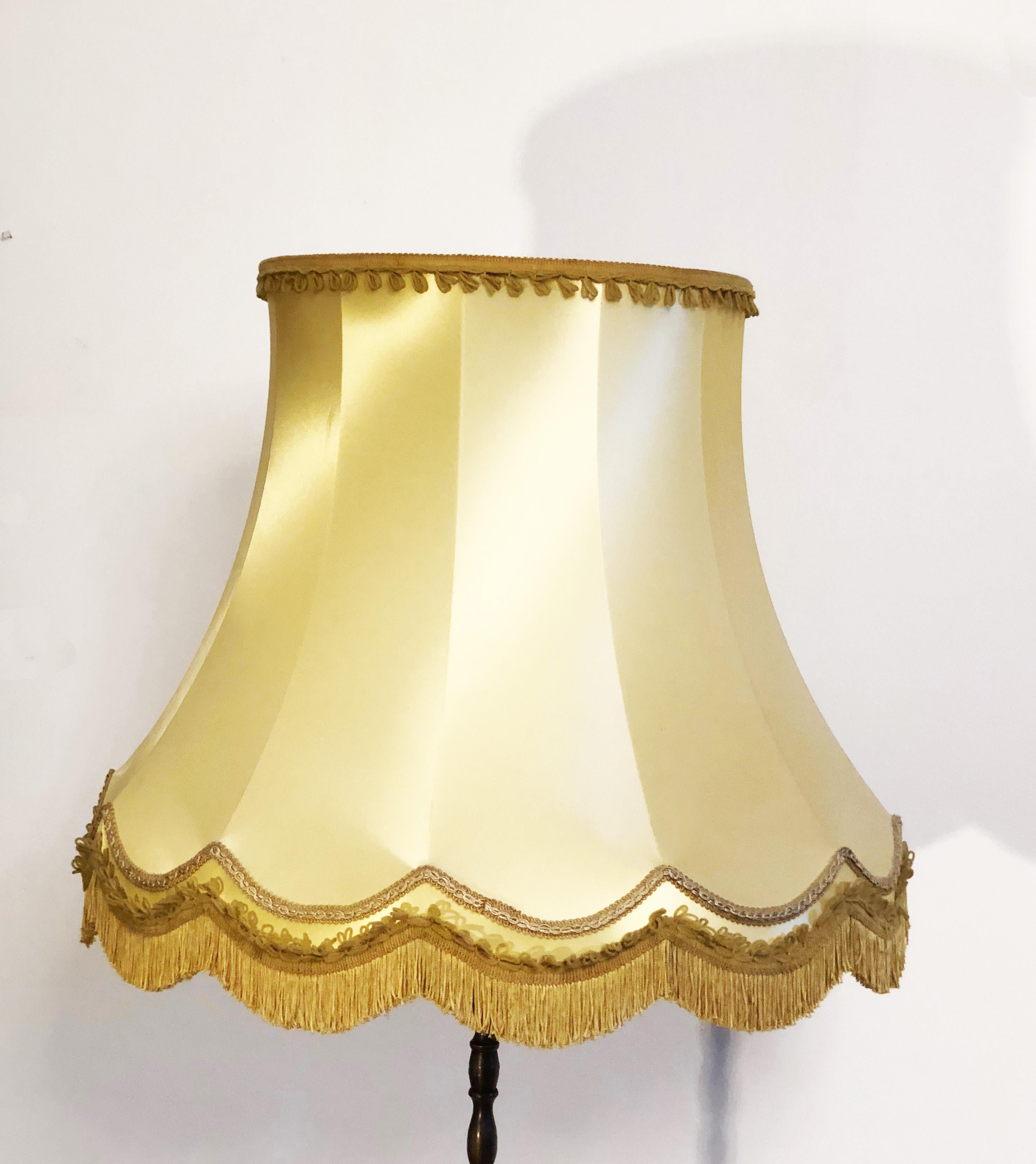Brass lamp food with fitted with two E26/E27 sockets up to 60 watts each, large silk shade. Made in France in the 1930s.