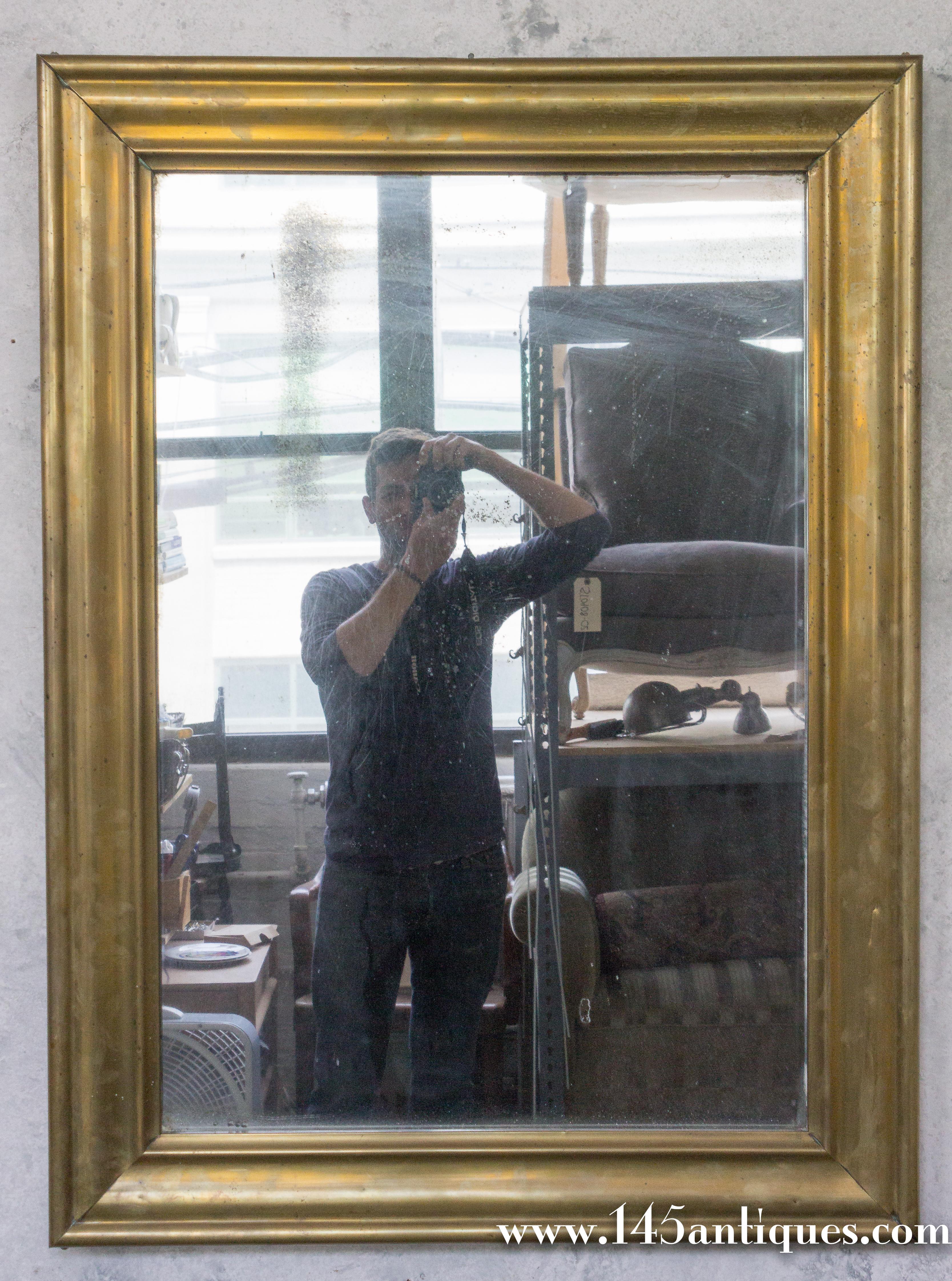 19th century French bistro mirror with a brass over wood frame. The mirror has the original wood partitioned backing. The original mercury glass has wonderful signs of aging, sold as is.


 