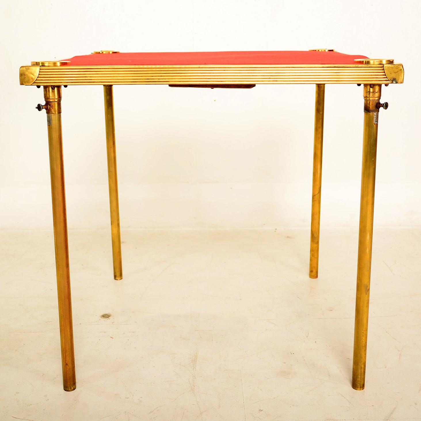 For your consideration a one of kind game table made in France, circa 1930s.

The construction is made of brass and wood frame. 

The legs can be removed with ease and stored underneath the table top with a very creative storage system.

Each
