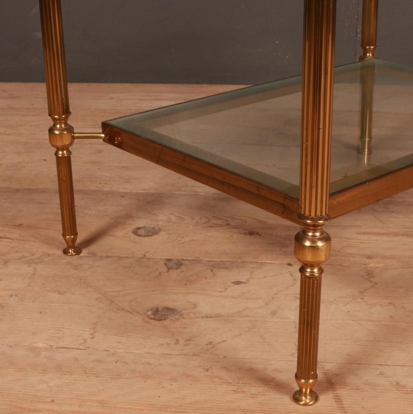 Single 20th century French brass and glass lamp table with a glass under tier, 1950.

Dimensions
24 inches (61 cms) wide
18 inches (46 cms) deep
16 inches (41 cms) high.

  