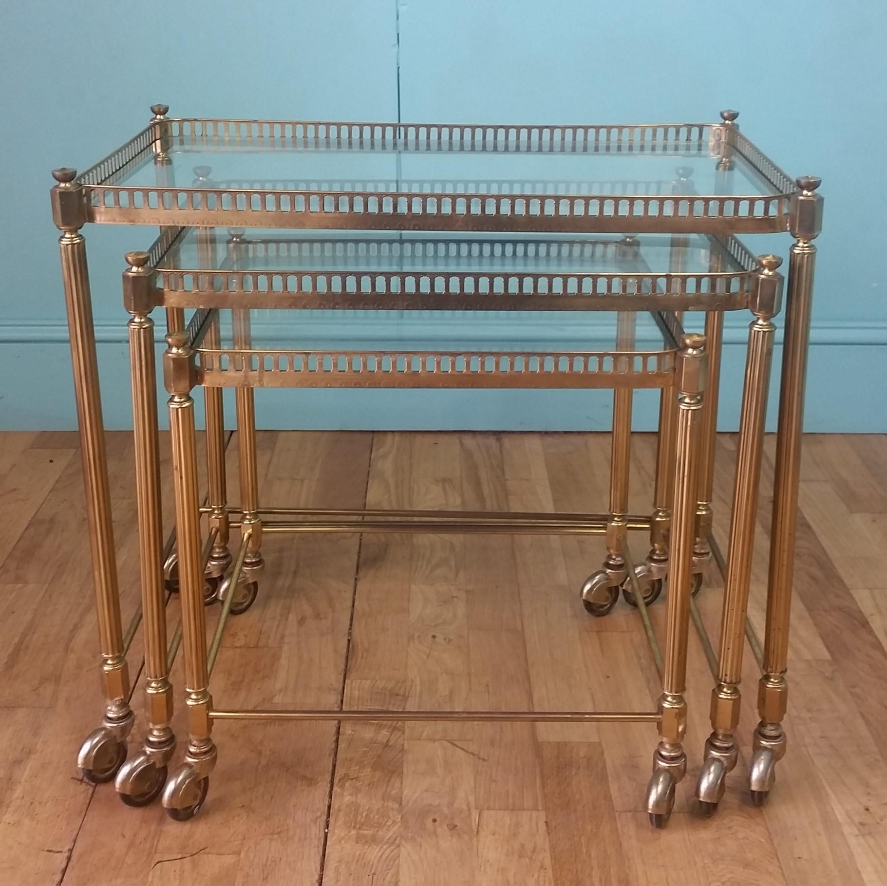 French mid century drinks trolley nest circa 1950 - 1960's
Decorative brass frames with reeded legs, pierced galleries and decorative finials.
Each trolley has original its glass and hooded brass casters to complete the French mid century