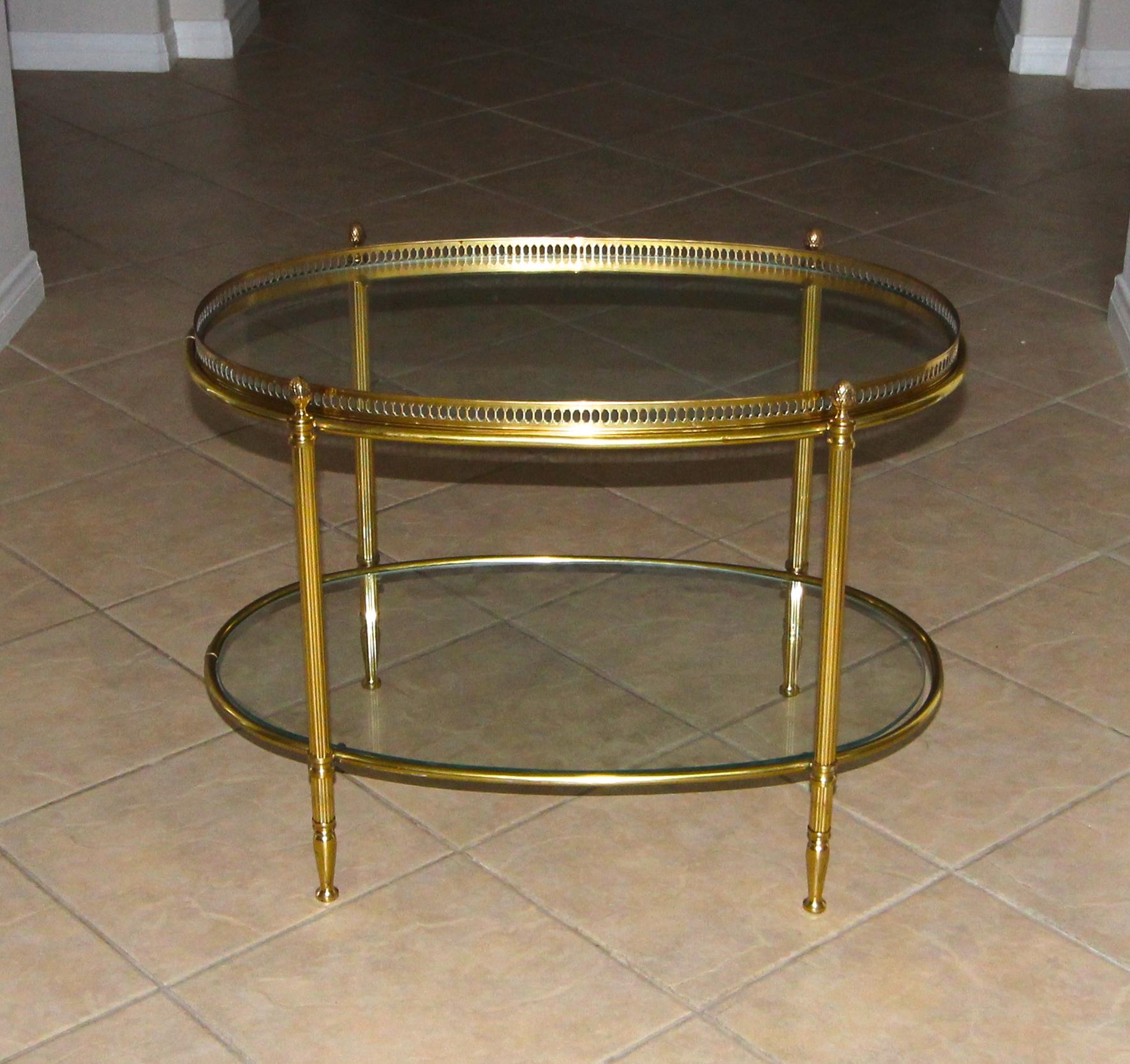 Oval two-tier brass French side table (or smaller scale coffee table. The top glass is inset into a removable tray, bottom tier has floating glass.