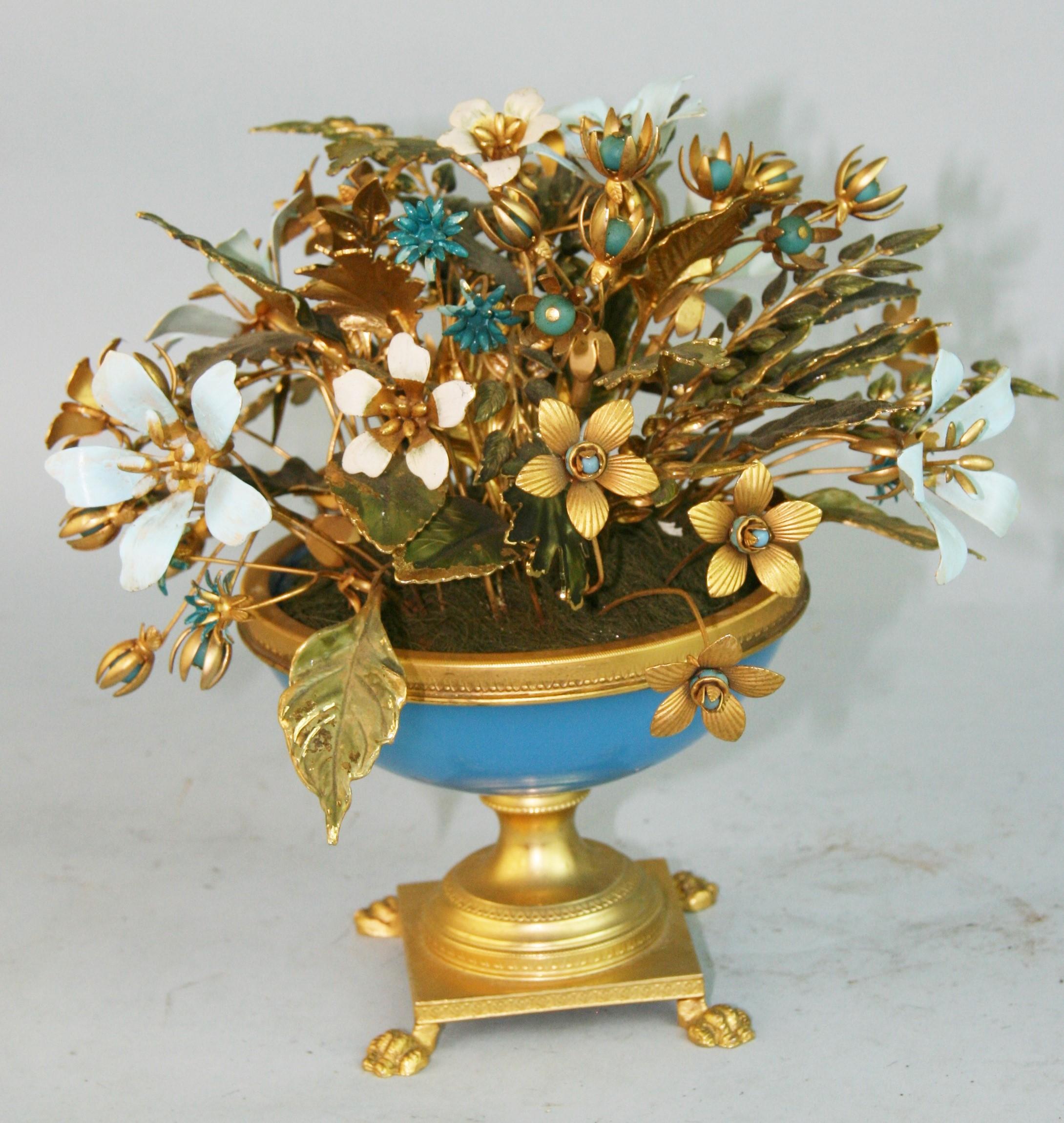 French bouquet of hand made painted brass flower in a blue and gilt bowl