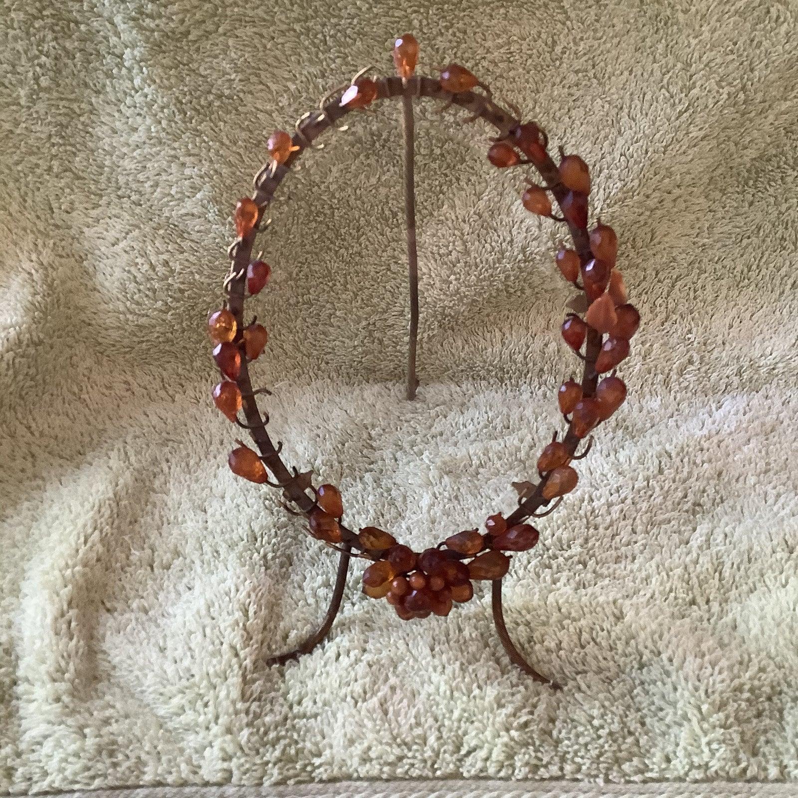 French brass photograph frame with amber glass jewels and beveled glass.
Rare antique French brass photograph frame with amber glass jewels and original beveled glass. The beveled glass is about 1/8 in size so very noticeable. The stand and legs