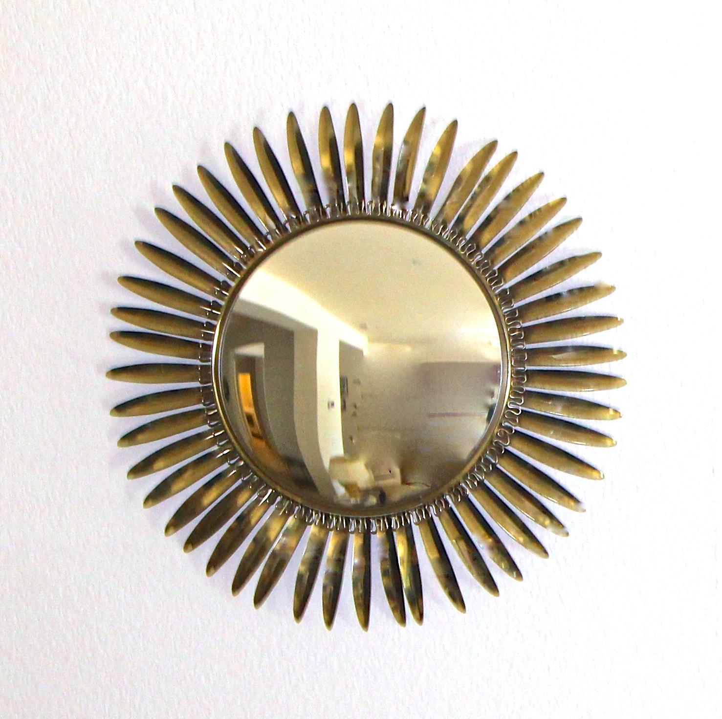 French soleil or sunburst style convex wall mirror with a undulating wire detail and 