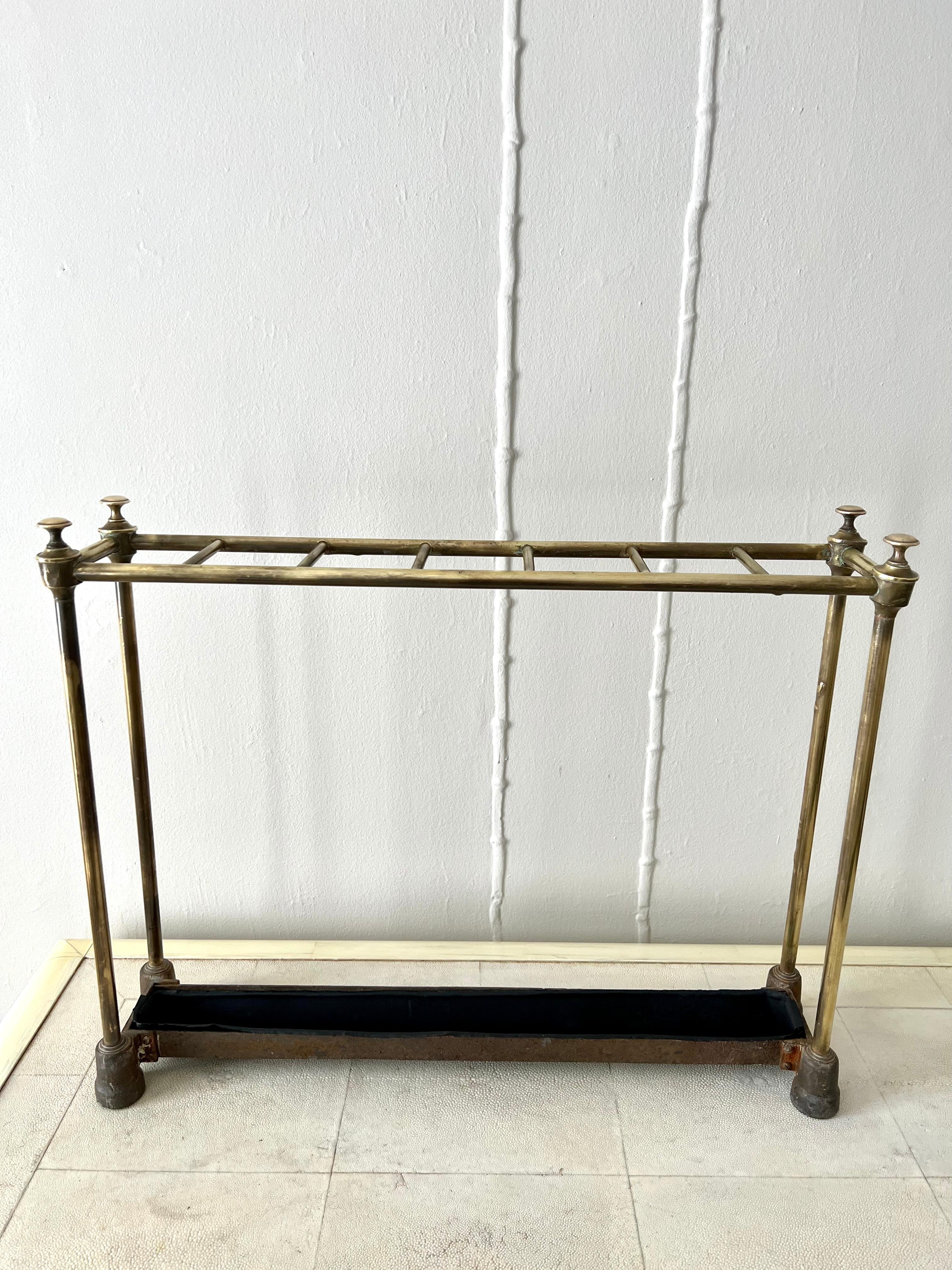 A very nice French umbrella Stand of Brass with 7 Openings atop and a removable tray below for excess water. The piece is a compliment to many entry ways, mud rooms, and would also be good for commercial use in a restaurant or business as it holds a