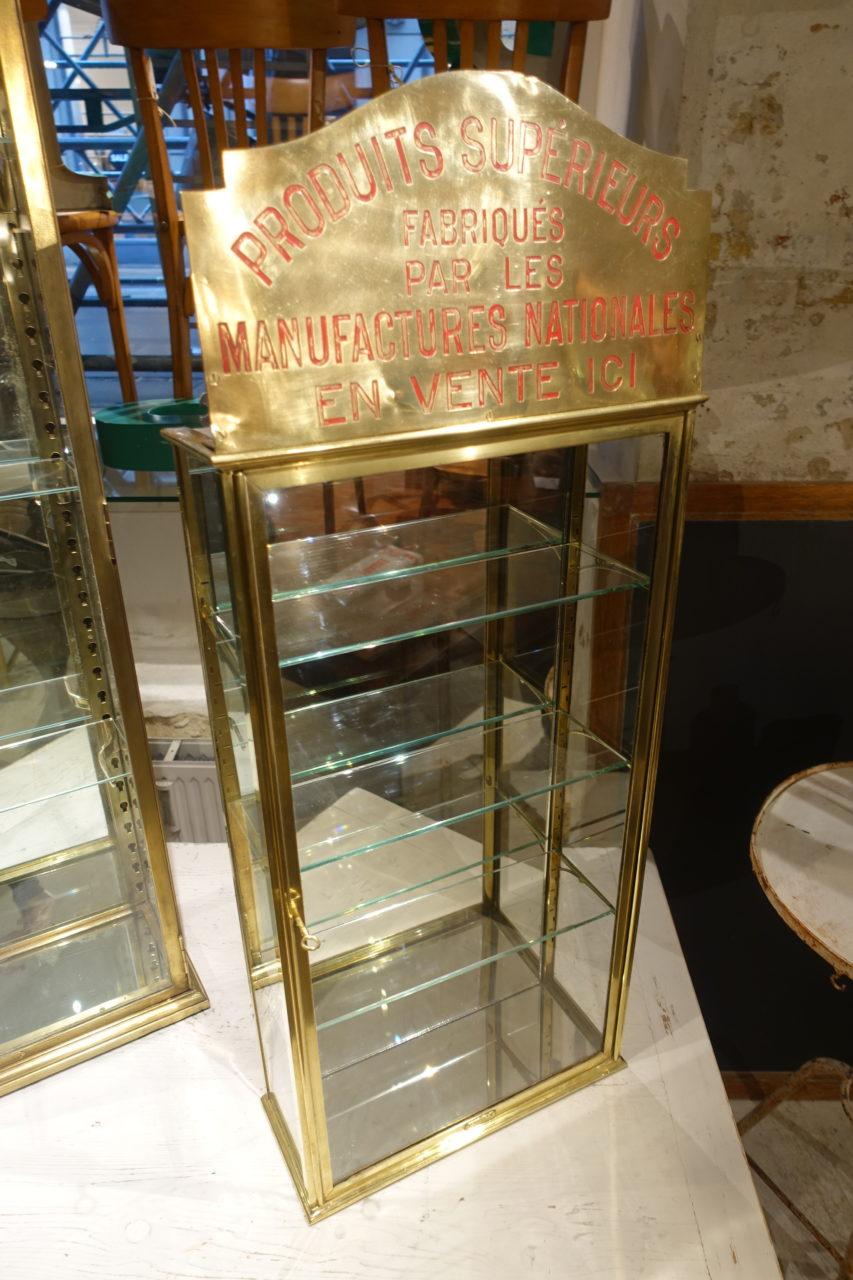 Gorgeous French vintage wall shelving display unit, made of brass, and accompanied with its three glass shelves, and their height adjustable brass brackets, and original key. Provenance – boutique inventory to showcase items. In lovely condition.