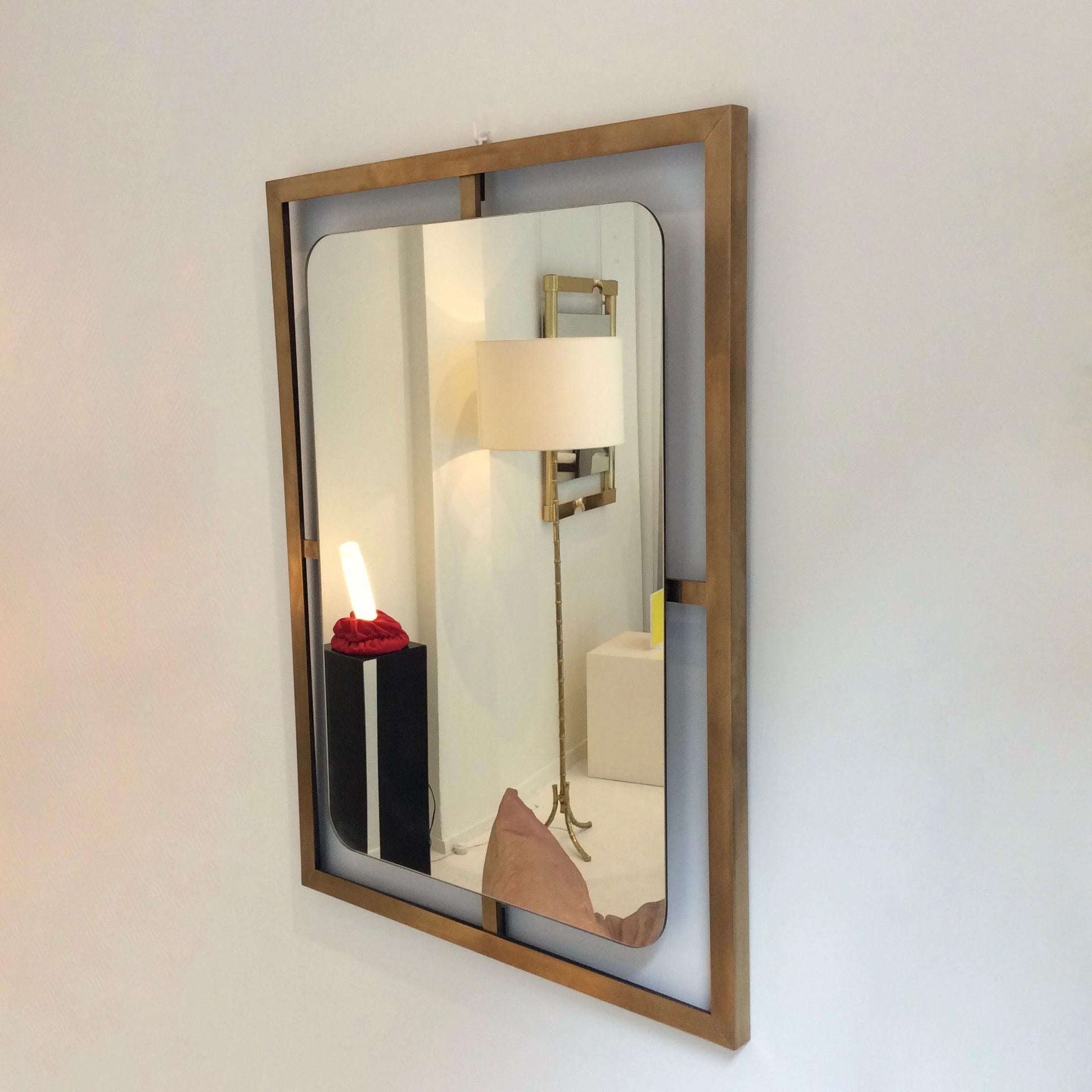 Elegant brass framed wall mirror, circa 1970, Italy.
Dimensions: 80 cm H, 60 cm W, 4 cm D.
Good original condition.
   