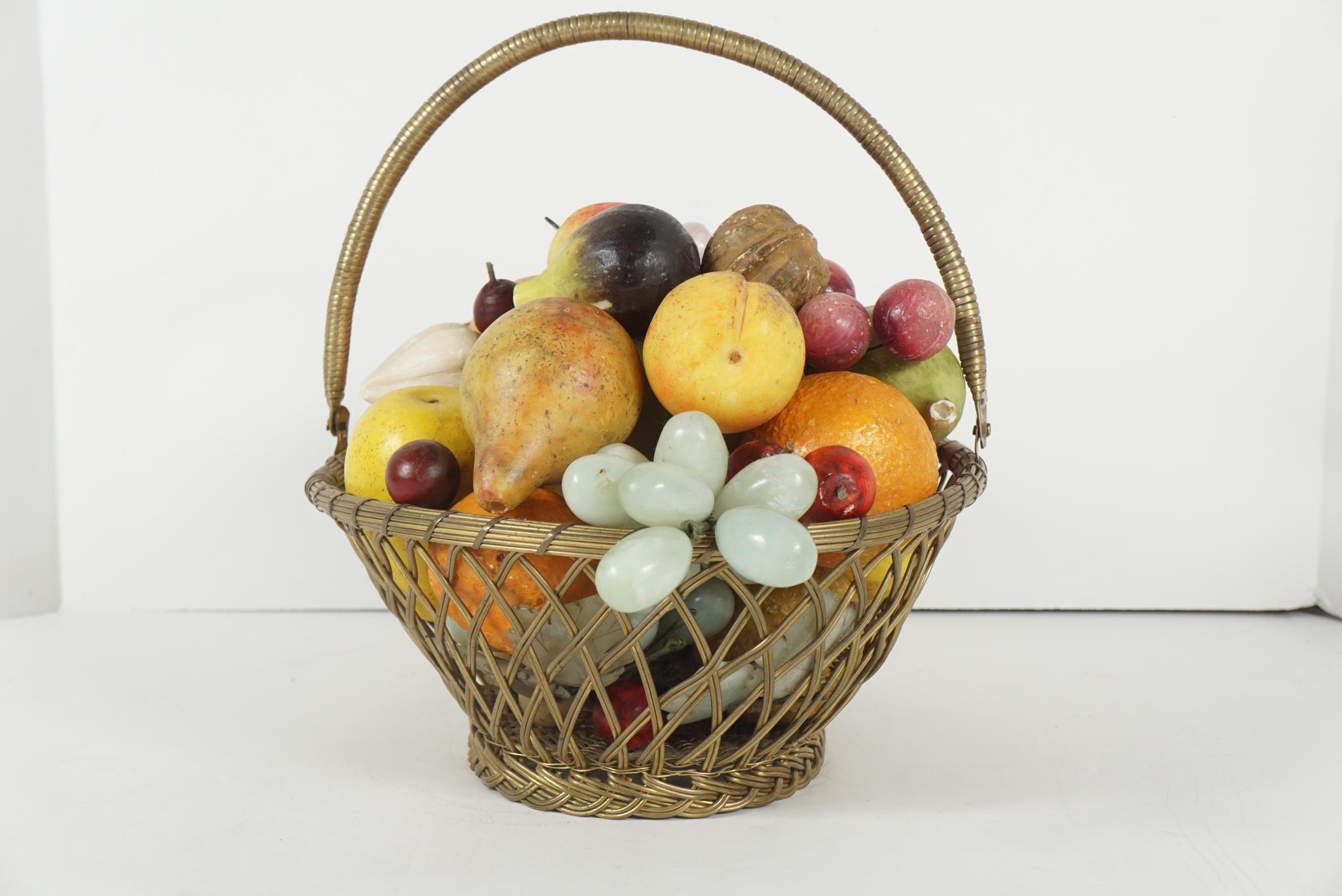 This vintage French brass woven wire basket contains 38 separate pieces of carved stone and painted fruit. The collection includes many unusual forms such has large walnuts, single cherries, carrots, garlic, figs and tangerines as well as pears,