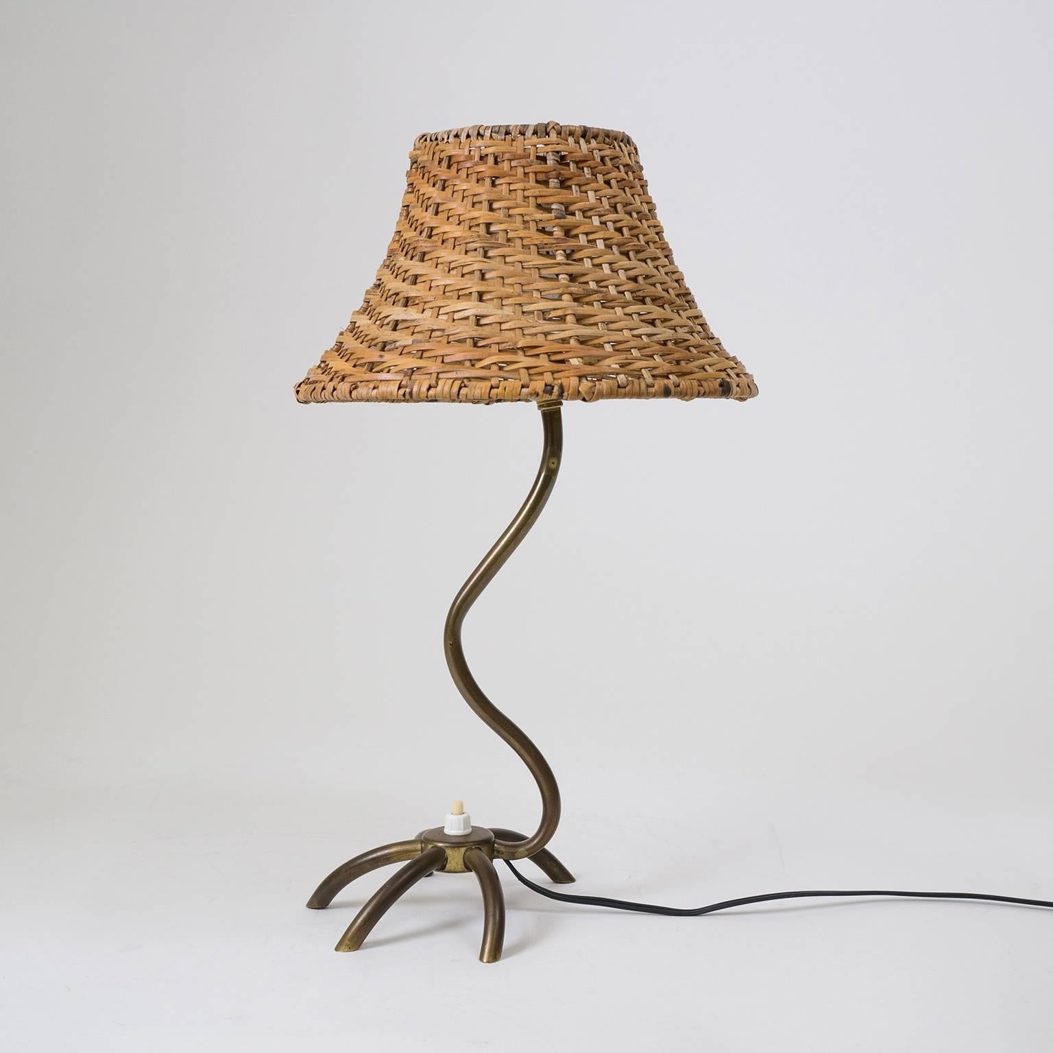 Very unique French brass table lamp from the 1950s. During the midcentury period in France there was a trend to incorporate shapes from the animal world into designs for lamps and other everyday items which was dubbed 