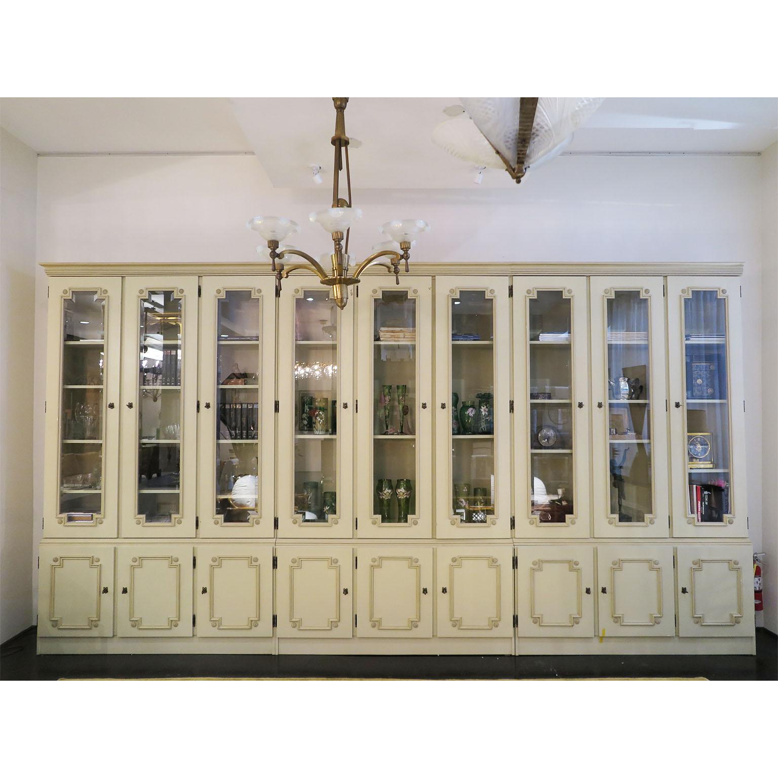 French bookcase with breakfront. Also to be used as cupboard for kitchen or dining spaces, our as decorative cabinet or vitrine for accessories and books in living room. Three units, each comprised of a top section with three beveled glass doors and