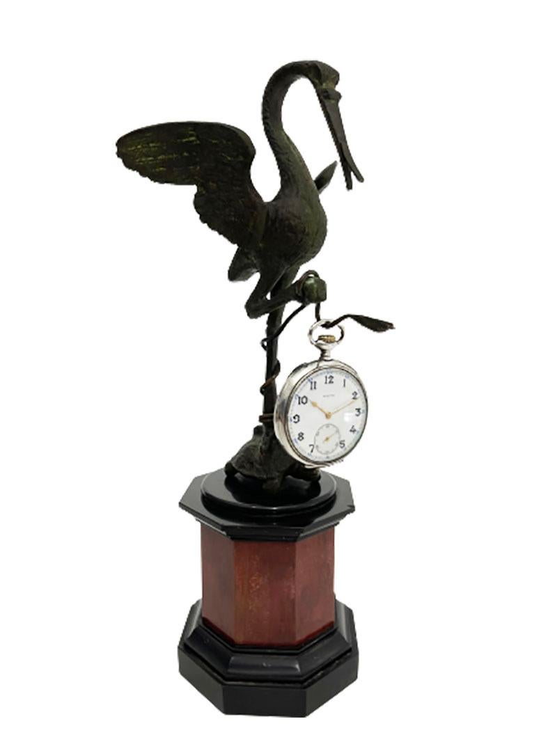 French bronze 19th century pocket watch holder with crane on a turtle

A French 19th century bronze sculpture of a crane with 1 leg on a turtle on a marble 8 sided base.
A bronze sculpture as pocket watch holder as shown in the pictures (pocket