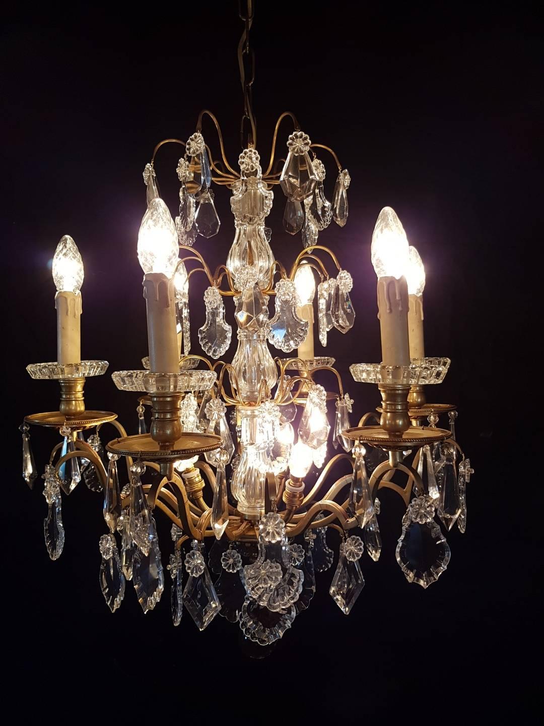 French bronze chandelier with six candlelights and three lights in the centre. Bobeches are from crystal. Beautiful chandelier and because of the low height it doesn't need a high ceiling.


 