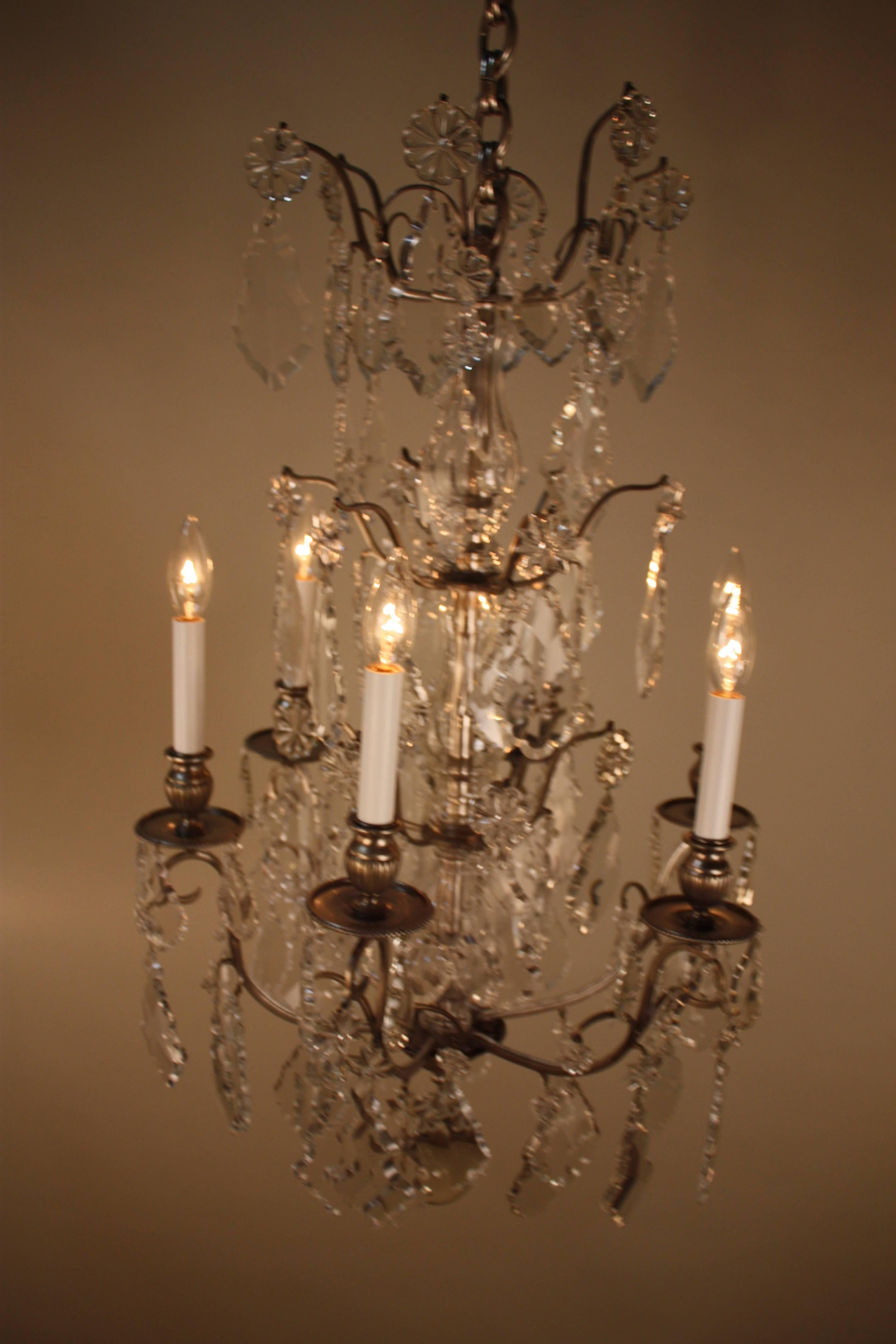 Fine hand-cut crystal chandelier with dark bronze frame.
Total of twelve-light, 60watts max each light.