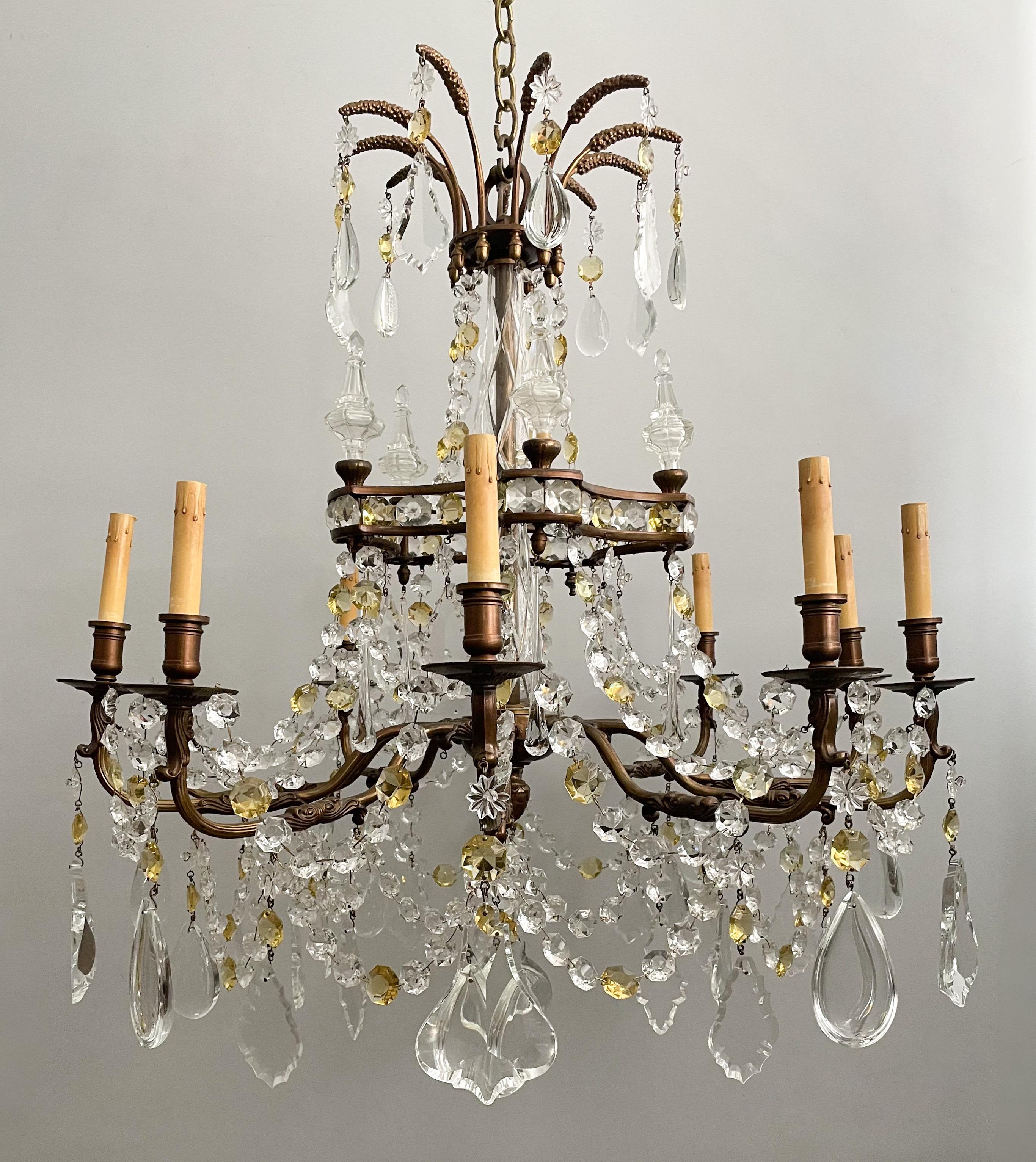 Gorgeous, French vintage bronze and crystal chandelier in the Louis XVI style. 

The chandelier features an ornate bronze frame with crystal and topaz glass decorations including removable crystal bobeches. 

The chandelier is wired and in