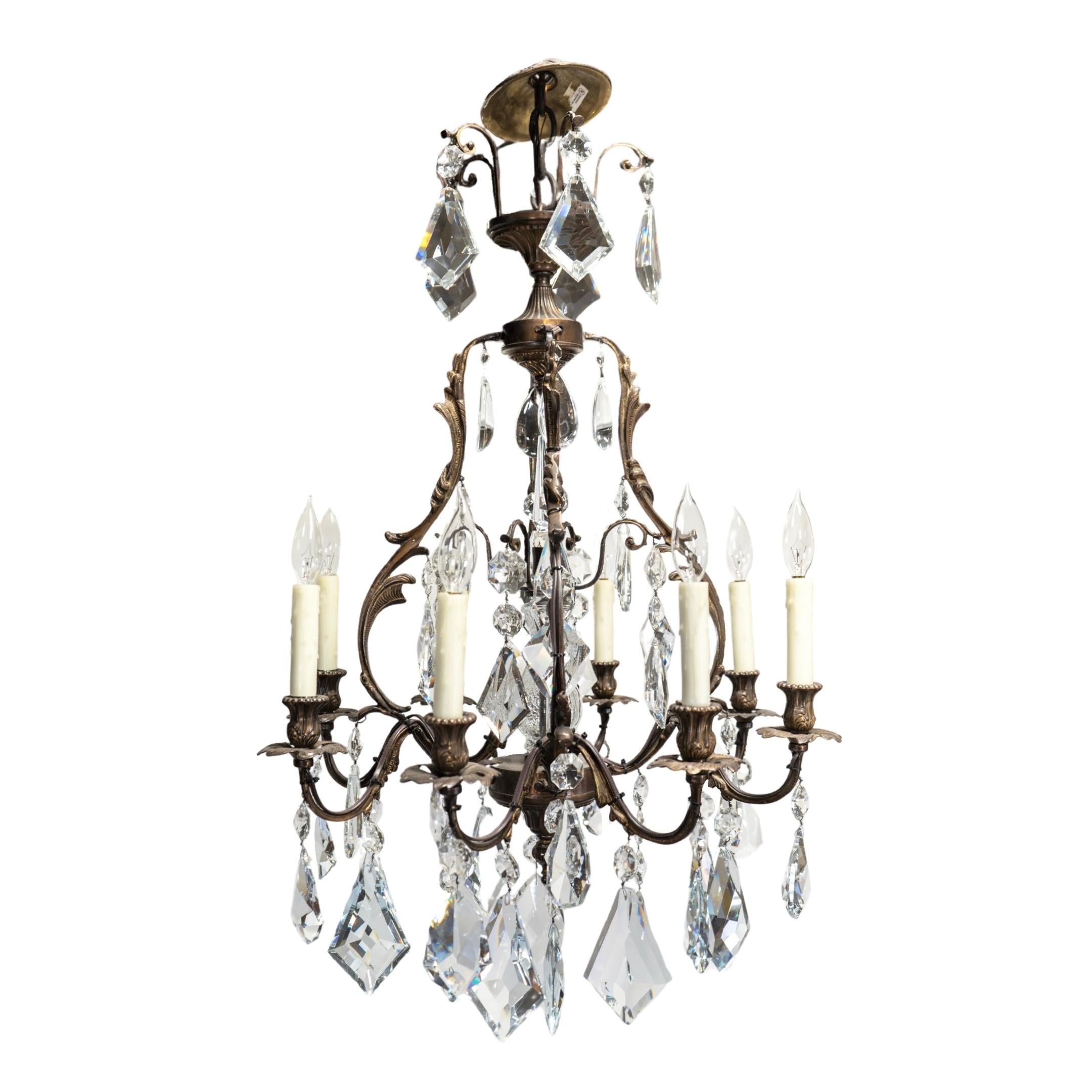 This French Bronze and Crystal Chandelier, crafted in 1990s France, offers a touch of elegance and sophistication to any space. With its intricate bronze and crystal design, this chandelier provides both functional lighting and a beautiful statement
