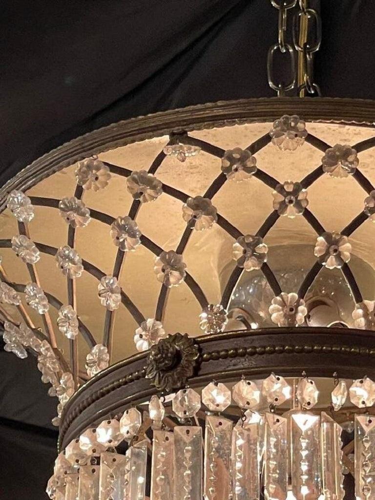 Extremely rare of French bronze and crystal flush mount Bagues style chandelier. Featuring beautiful cascading glistening crystals and a lattice pattern with beads at the top. Very fine quality and super elegant! Stunning!!