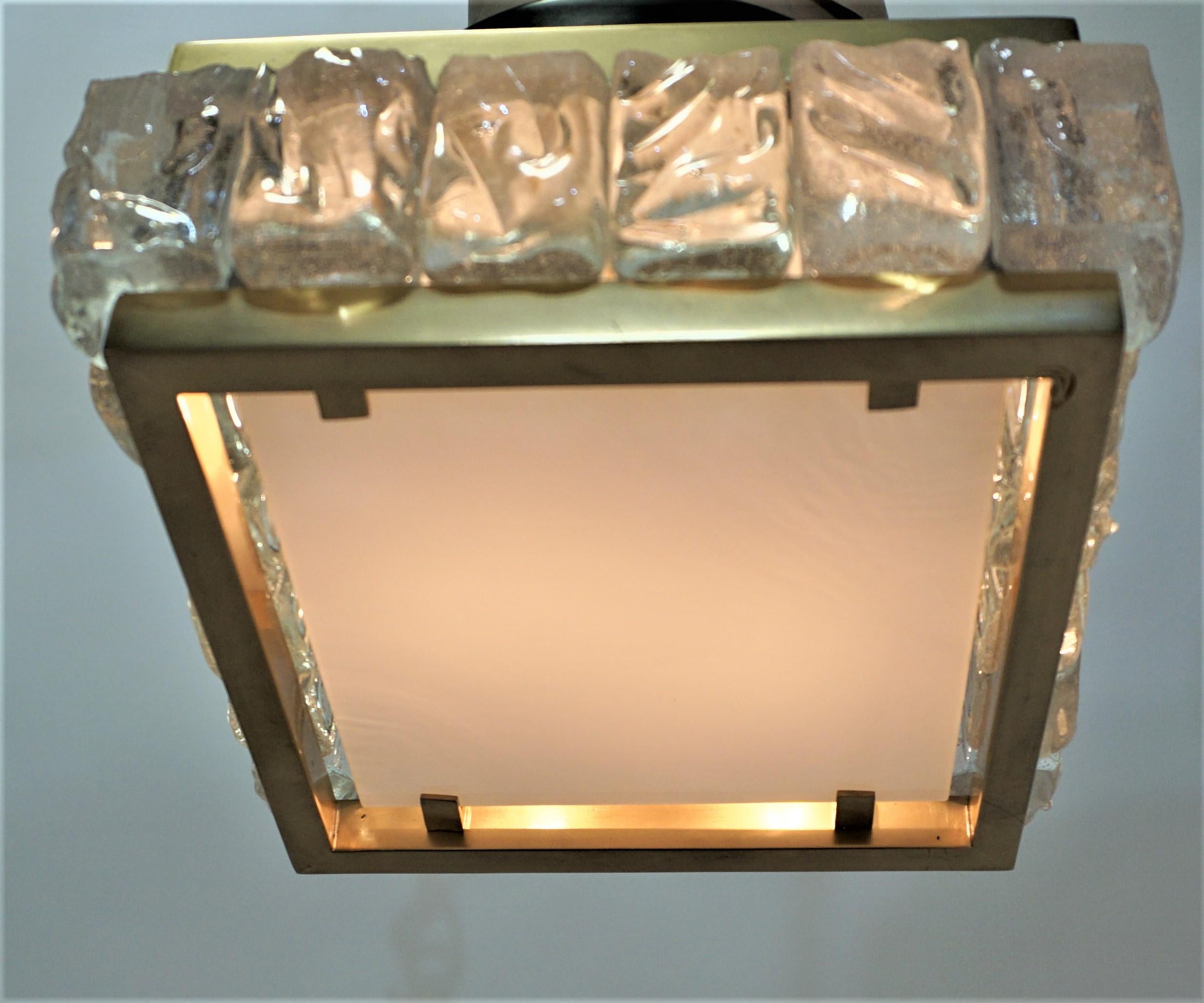 Petite square design in a ice shape glass panels framed in bronze with white glass diffusing at bottom. 
Two lights 75 watts each, bulbs are included.