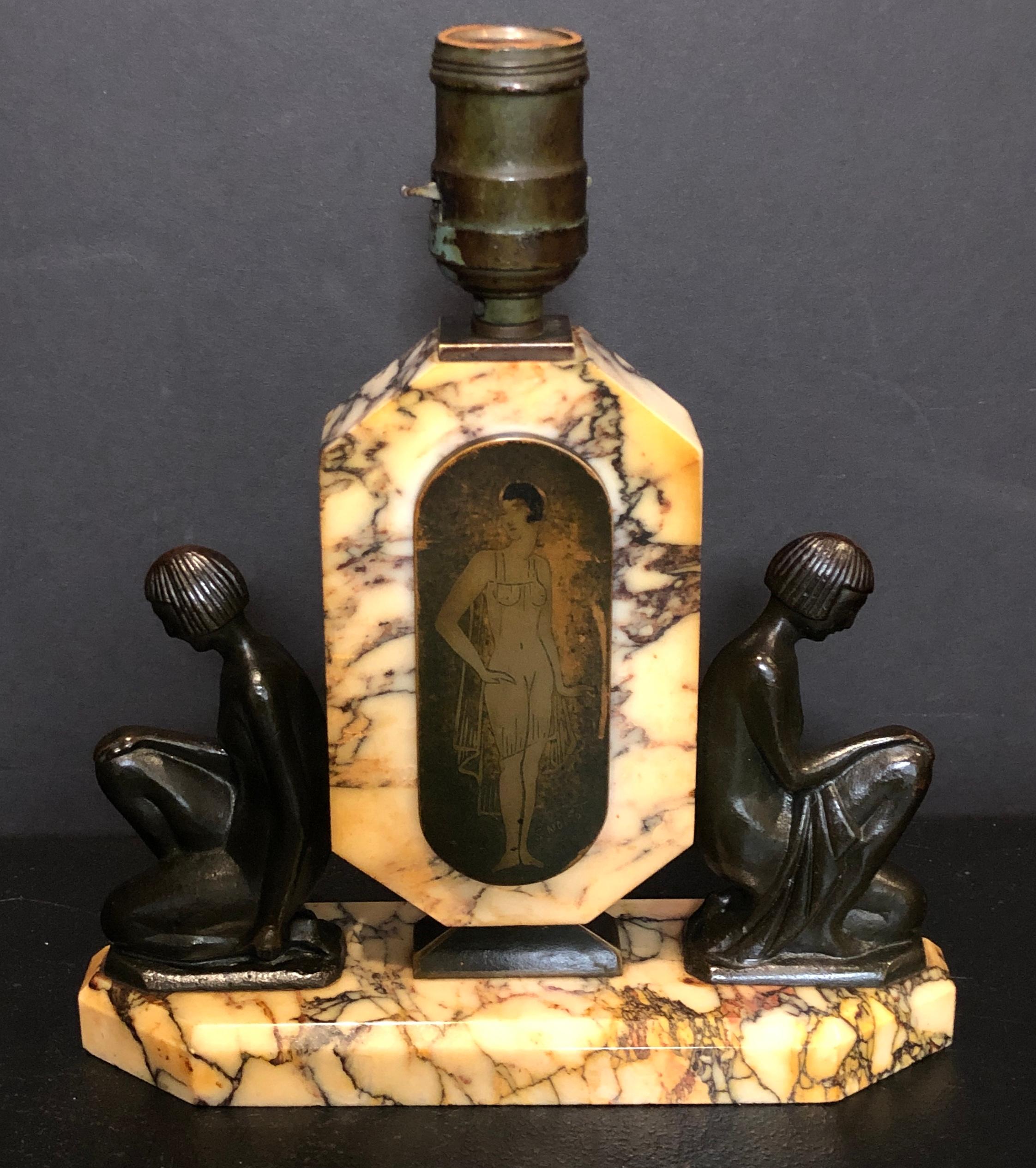 French Art Deco signed bronze and marble figural lamp. Artist-signed S. Noirot. Patinated bronze female figures on beautiful heavily veined marble base on either side of an etched and patinated figure of women in scantily clad in 1920s attire.