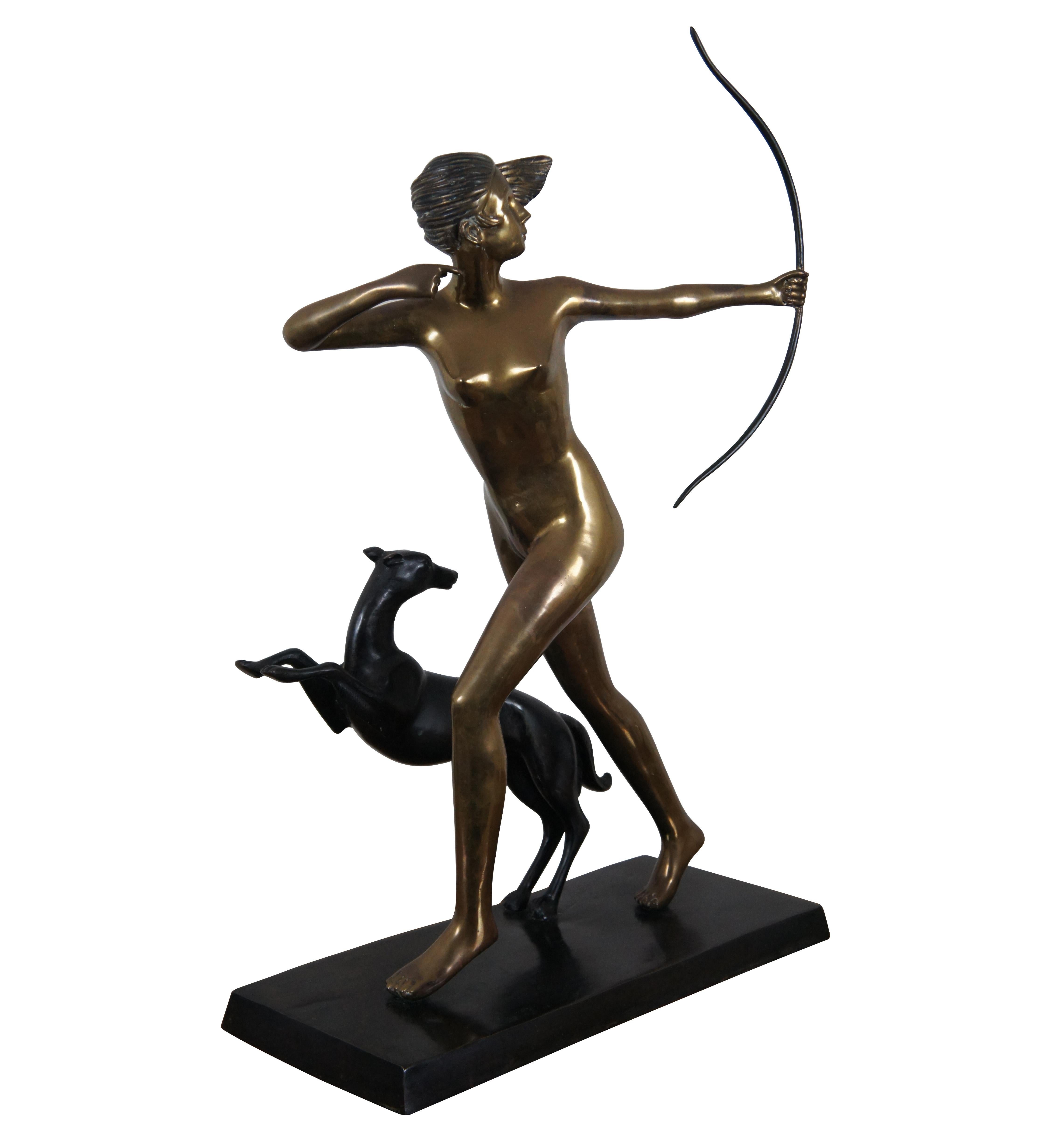 A large and impressive vintage art deco style bronze and brass nude figural sculpture of the Greek / Roman goddess of the hunt Artemis / Diana, shooting a bow as she runs side by side with a Greyhound dog. Marked / signed on base.

While Diana is