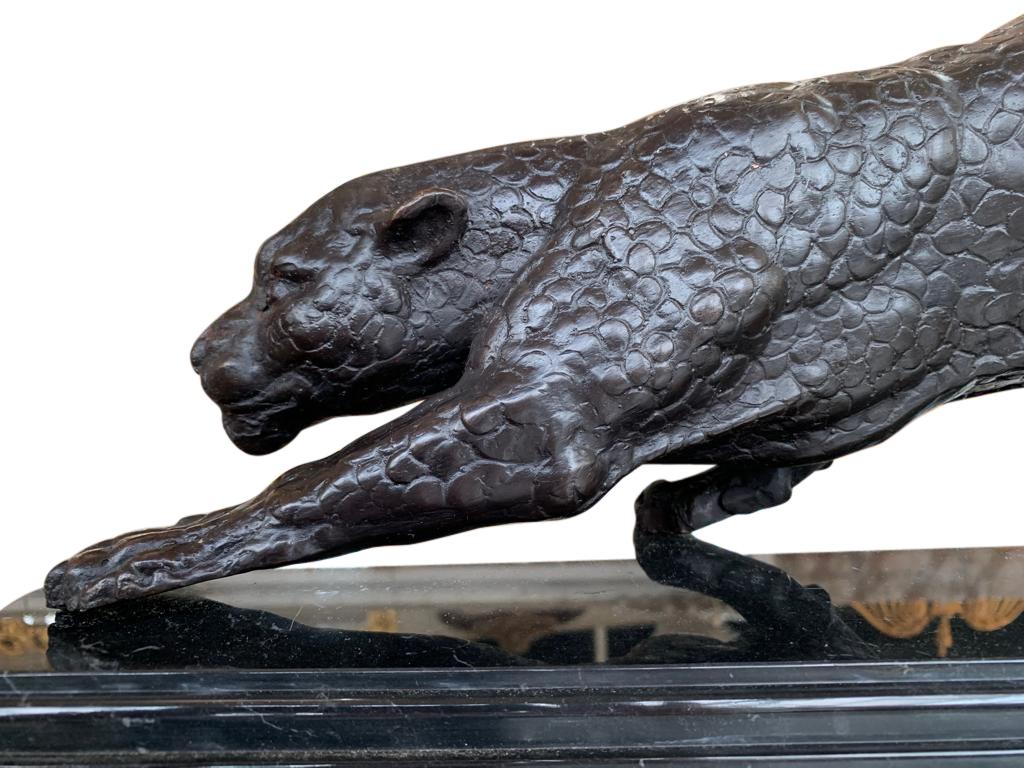 Gorgeous French bronze casting of an Art Deco style puma or panther. Classically sleek and aerodynamic with lovely patina to the bronze. Stands on the black marble base which is smooth and chip free. Offered in excellent shape ready for home use