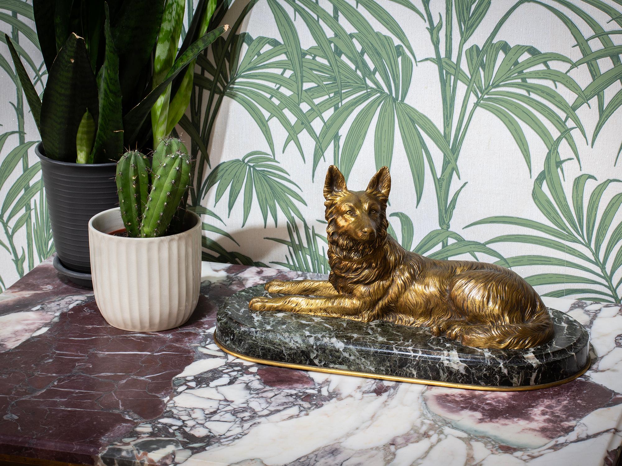 French Bronze Circa 1905 upon a Marble Oval Base

From our Sculpture collection, we are pleased to offer a French Bronze Belgian Shepherd Figure. The figure mounted upon a green marble base with a convex rim and ormolu border. The bronze cast as a