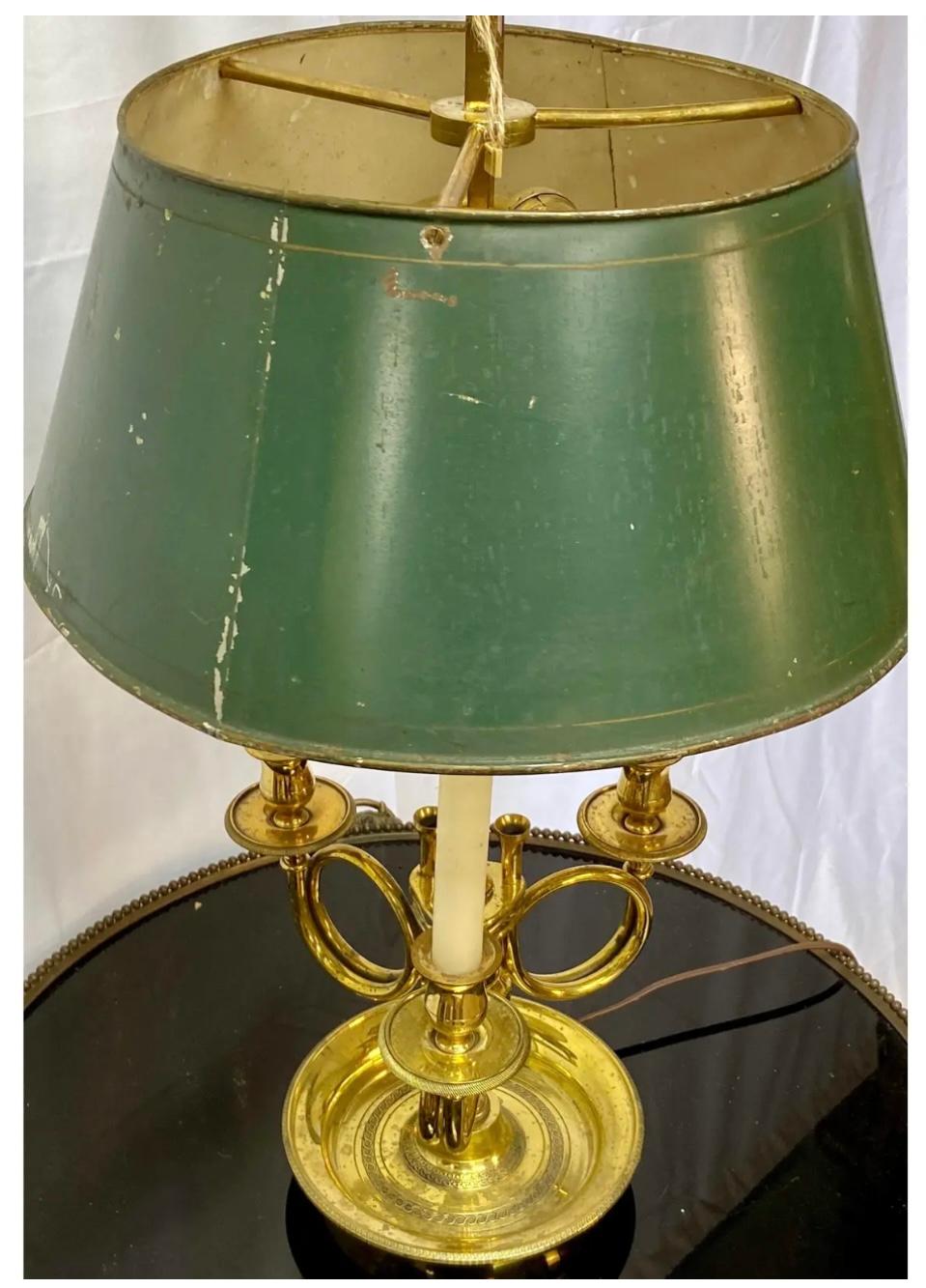 French bronze Bouillotte lamp with green and gold metal shade. Lamp has two light sockets as well as three candle holders. Some age appropriate wear and patina.