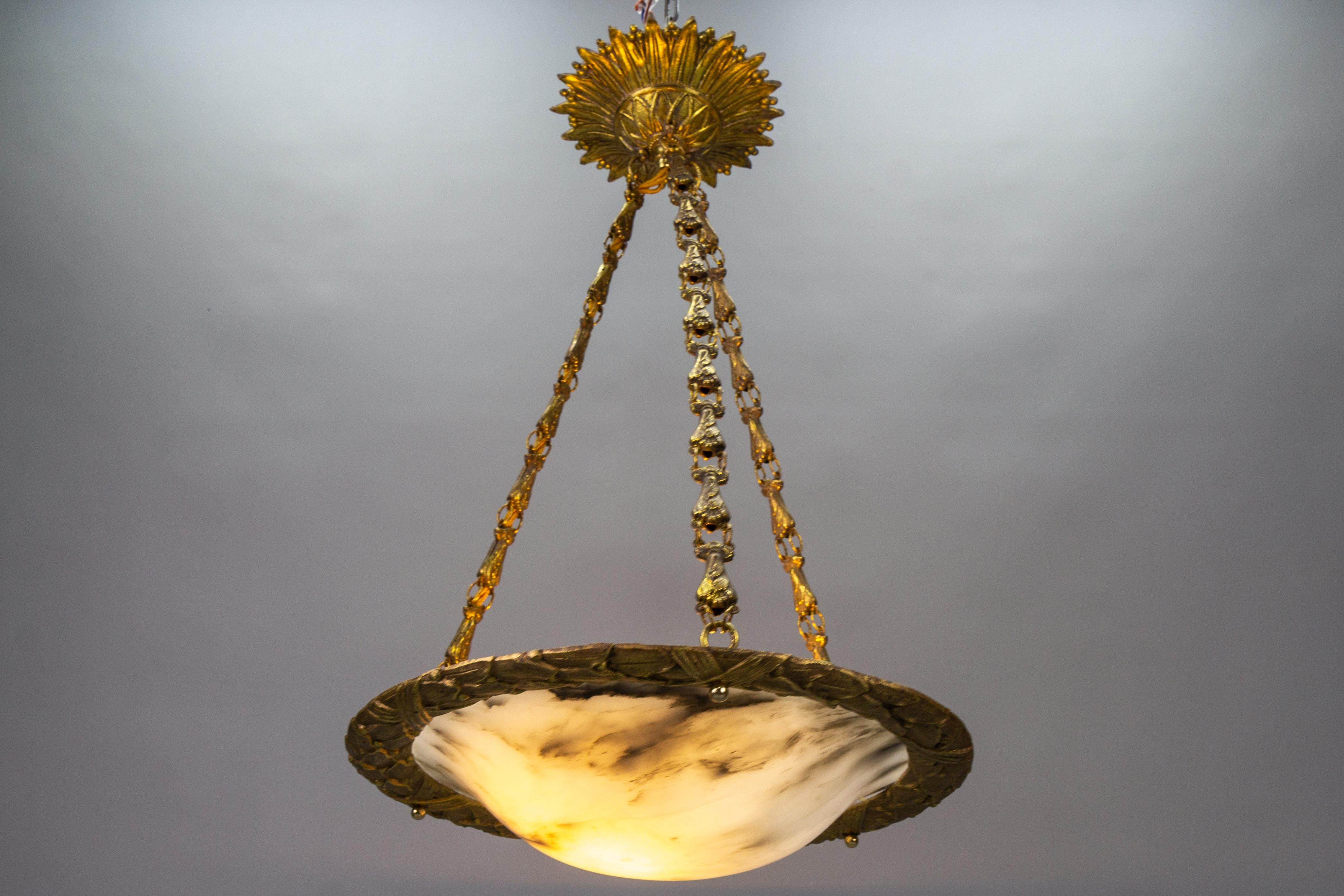 Early 20th Century French Art Deco Bronze and White Alabaster Pendant Light, ca. 1920