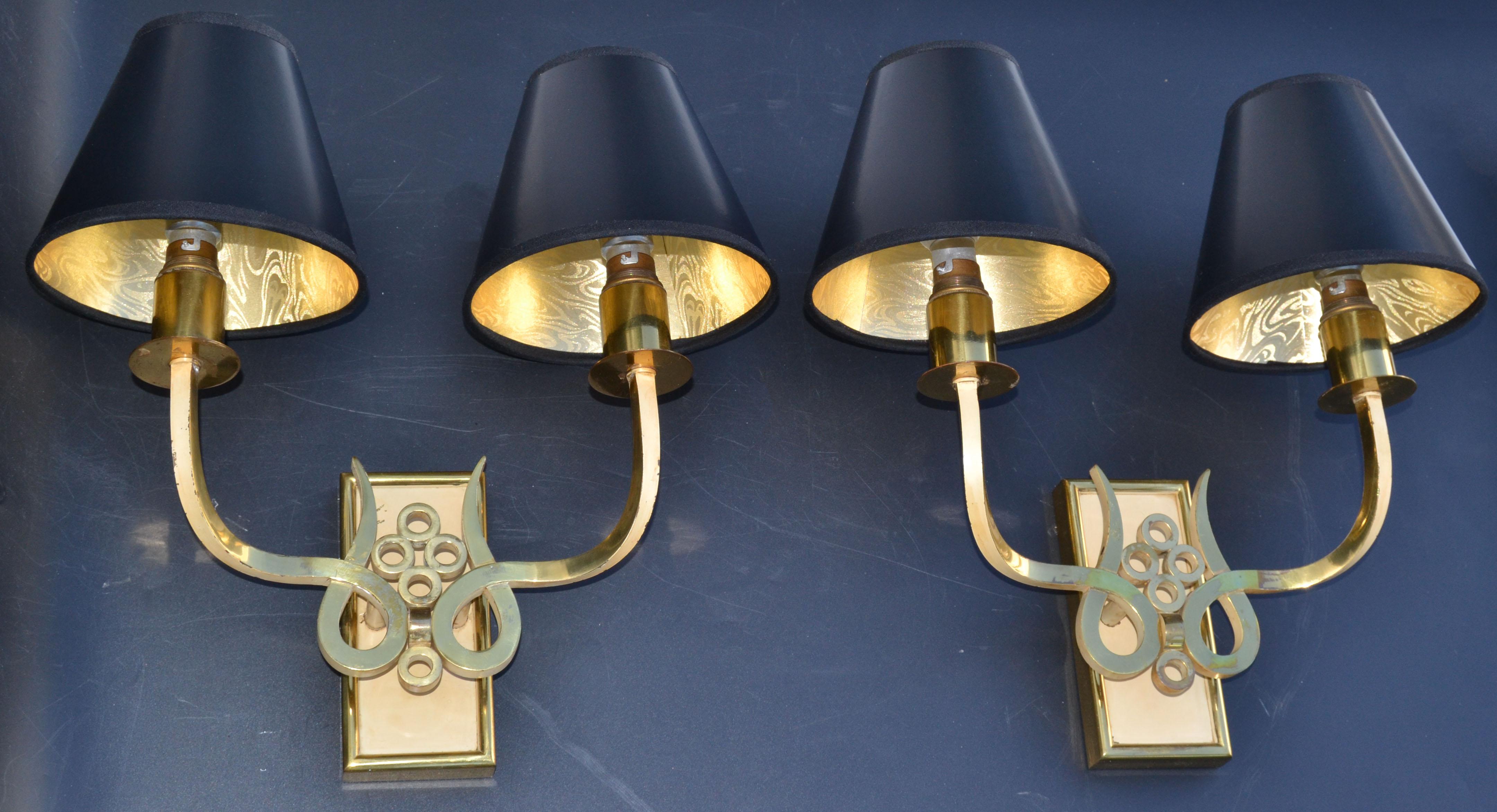 Pair of circa 1955 French Mid-Century Modern bronze & brass sconces, wall lights with shades in black & each sconce takes 2 light bulbs max. 60 watts.
Measurements with the shades: 13.75 inches width, projection to the wall: 7 inches.
Back plate: