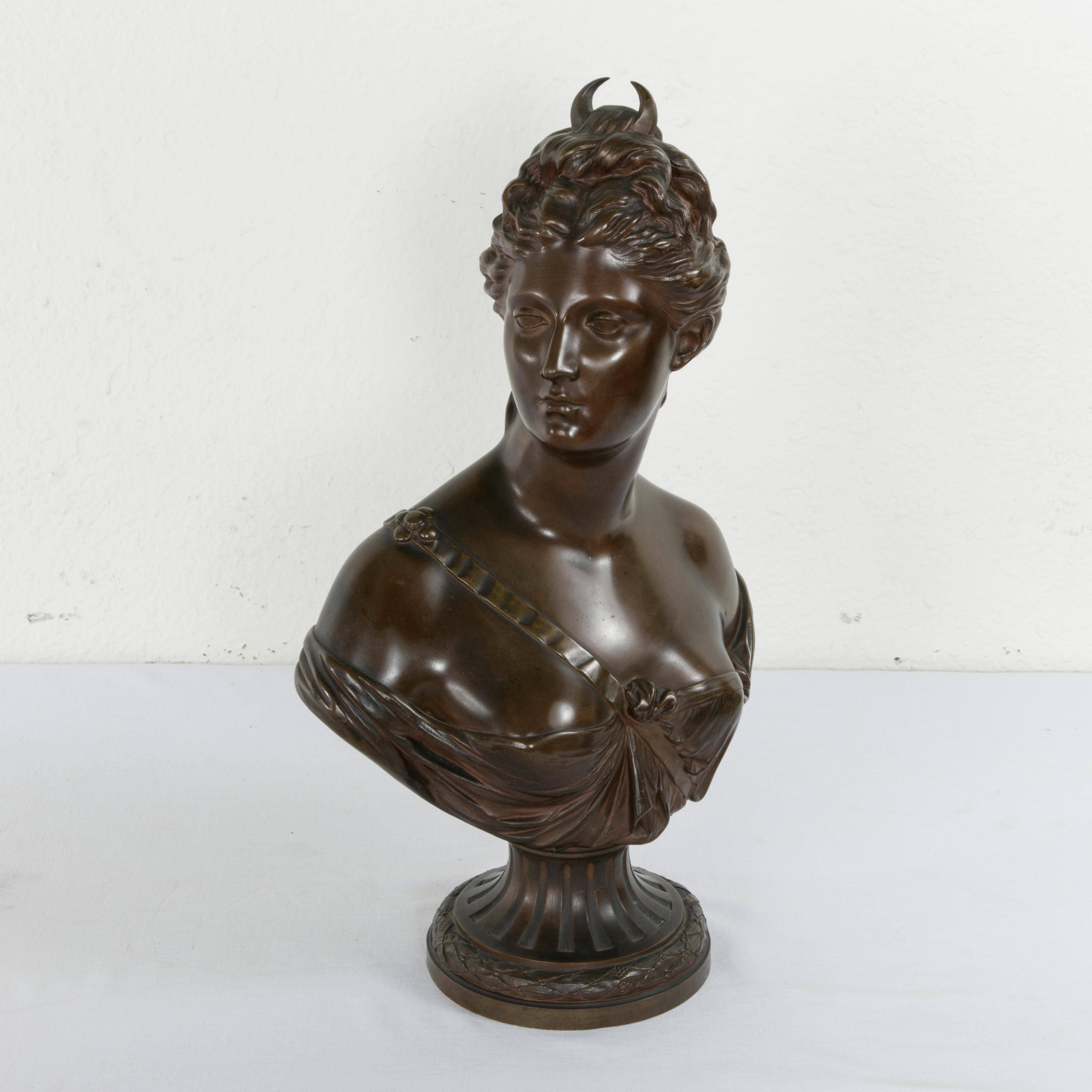This turn of the 20th century French bronze bust of Diana, the Roman goddess of the moon and of the hunt, is a piece after the eighteenth century French neoclassical sculptor Jean-Antoine Houdon (1741-1828), and is marked Houdon 1767 on the back.