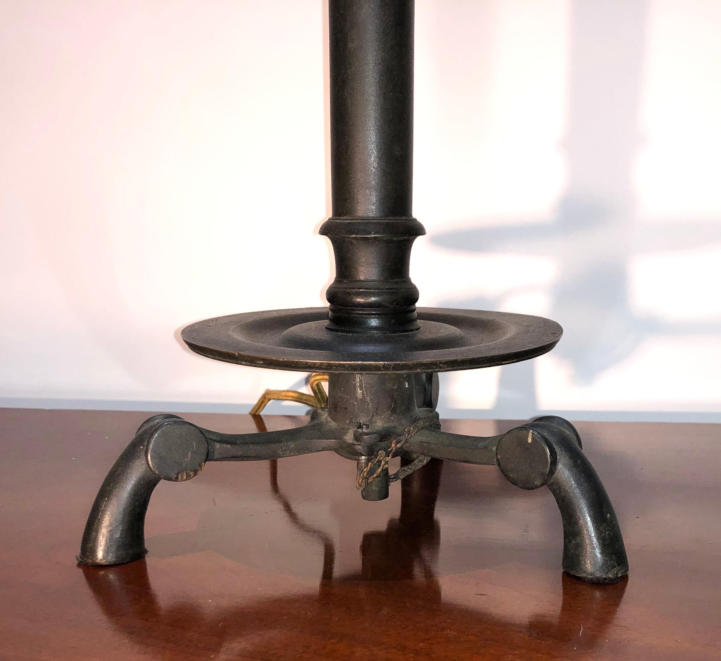A rare 19th century military campaign French candlestick with folding legs. This great candlestick is made of bronze and was converted from candle to electricity.