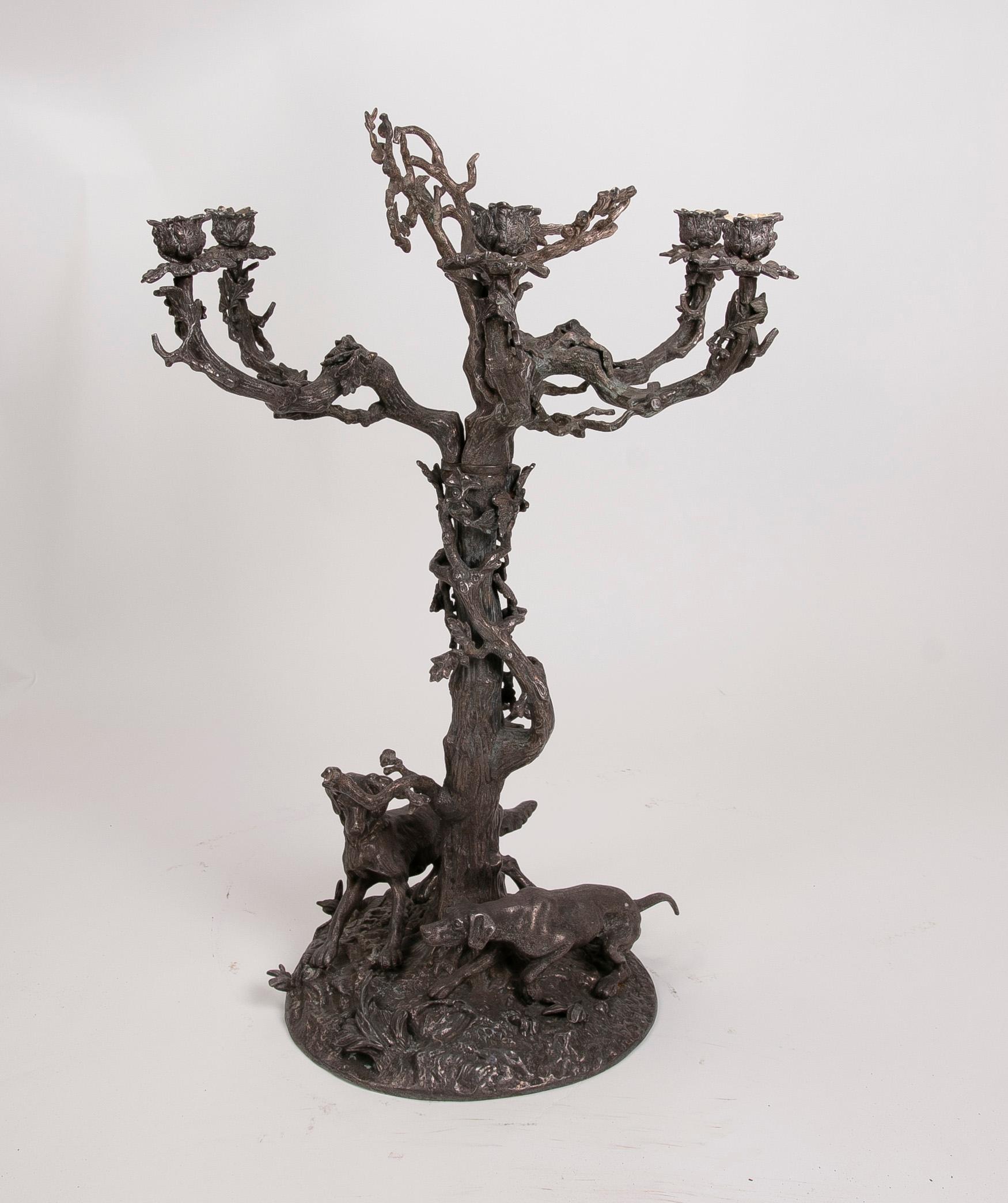 French bronze candleholder in the shape of a tree and decorated with dogs.