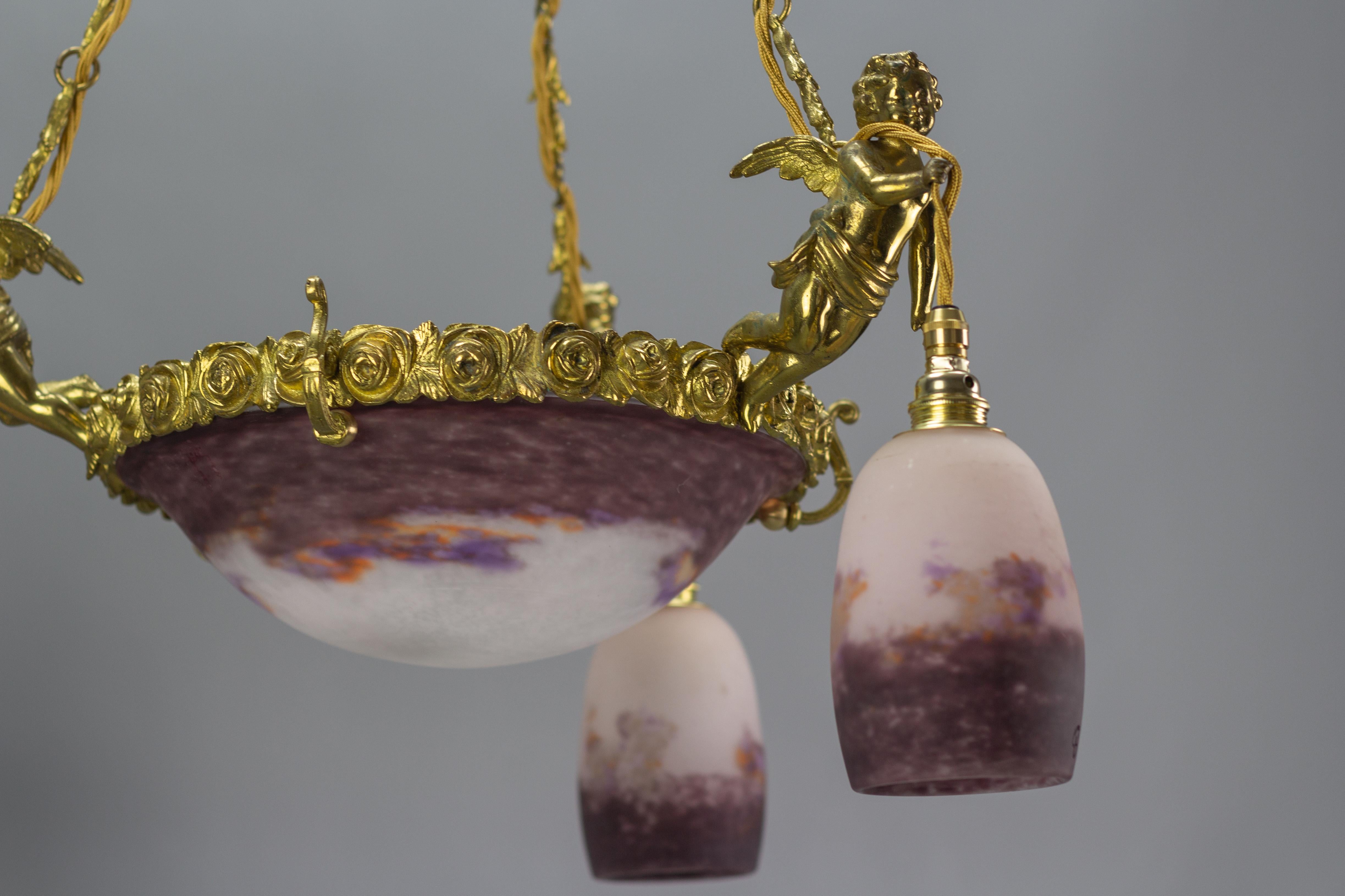 French Bronze Cherub Chandelier with Violet and White Glass Signed by Degué 4