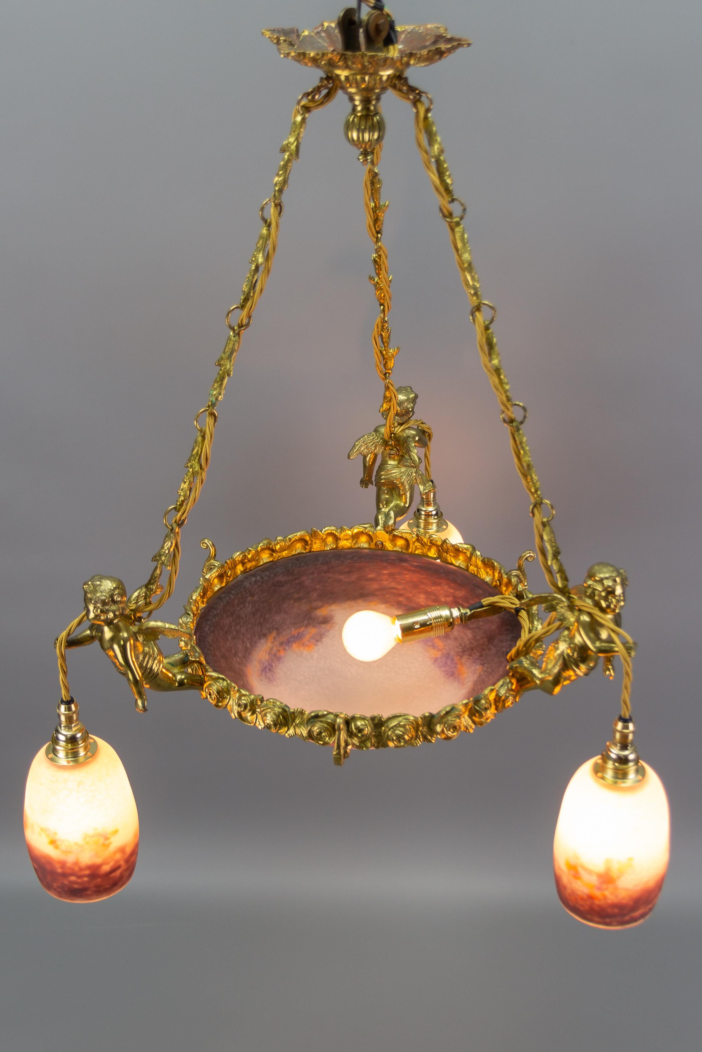 French Bronze Cherub Chandelier with Violet and White Glass Signed by Degué 9