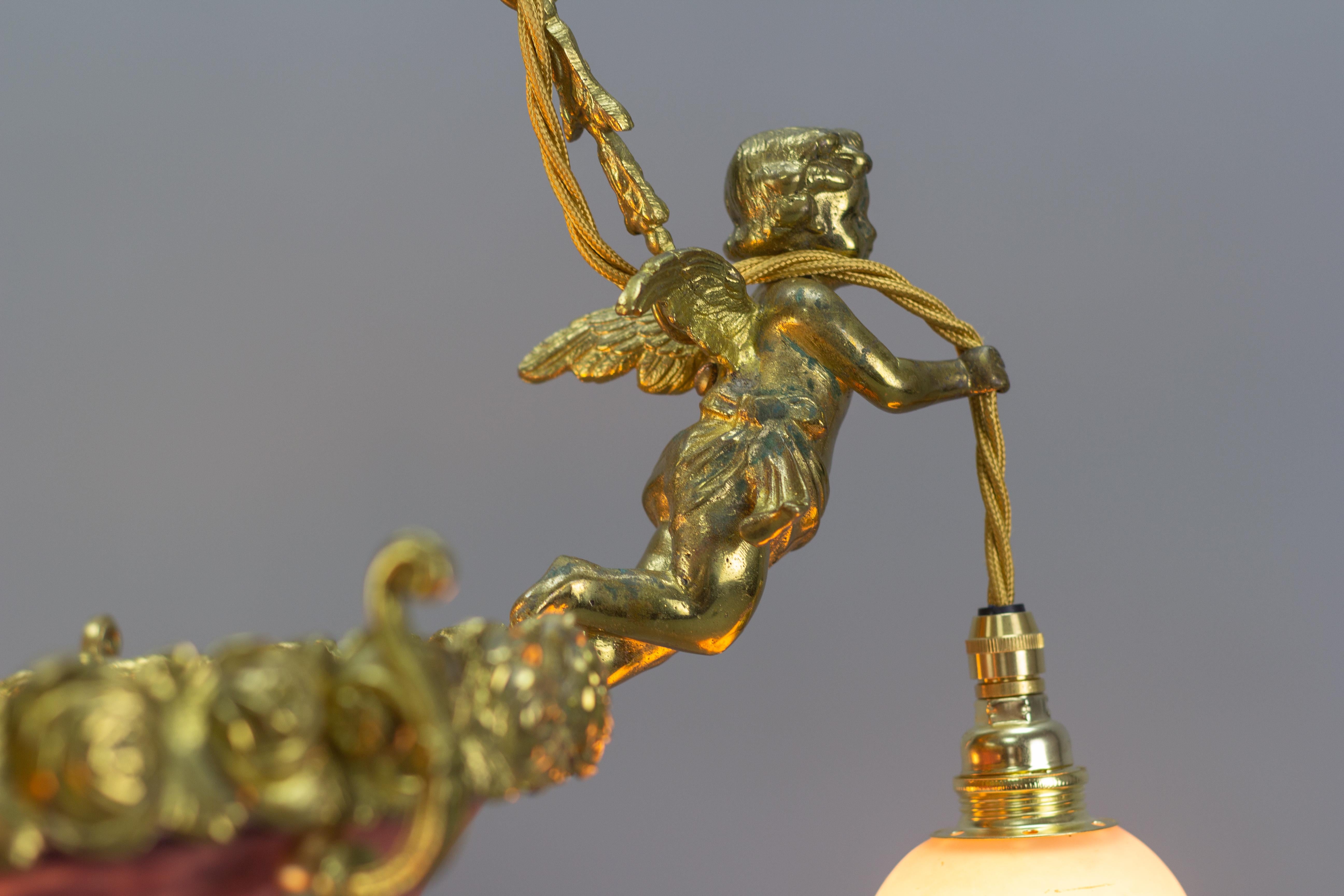 Brass French Bronze Cherub Chandelier with Violet and White Glass Signed by Degué