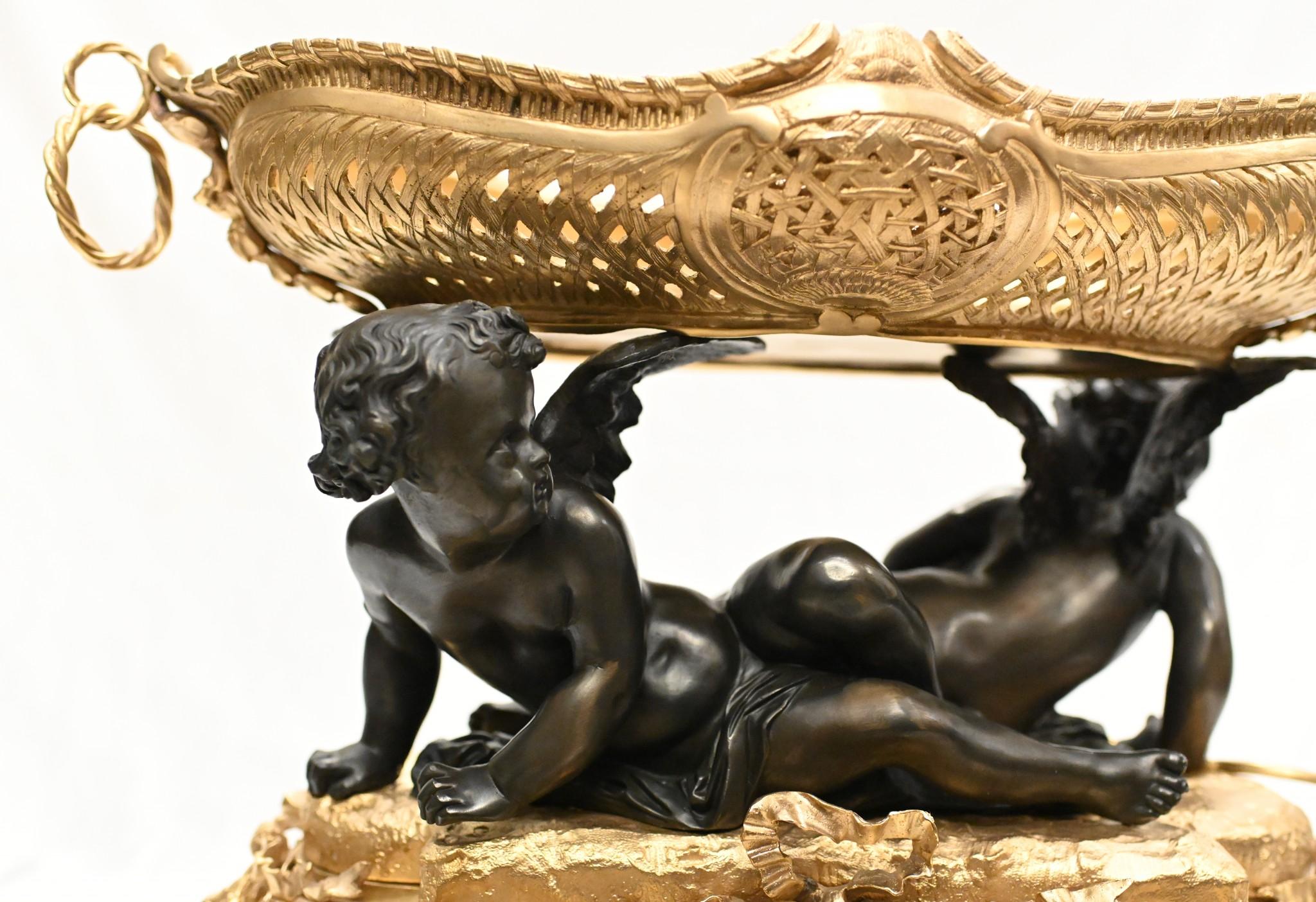 Stunning single French bronze and ormolu cherub dish- or tazza
This stunning piece is in the manner of Clodion
Visually stunning and of outstanding quality
Classic chubby putti in bronze hold aloft the gilt bowl
The gilt sections - particularly the