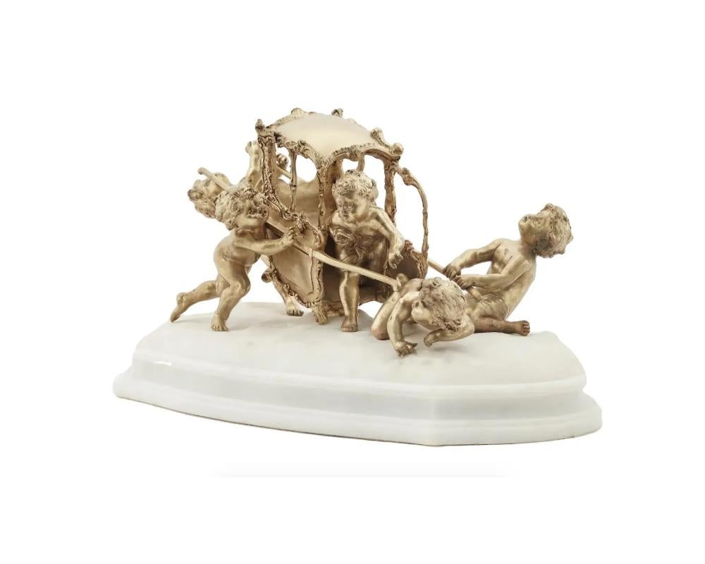 Louis Gossin, French, 1846 to 1928, gilt bronze figural sculpture depicting a group of cherubs with a turned over carriage. Signed to the marble base, circa the early 20th century. Louis Gossin was known for realistic female figures, and bronze and