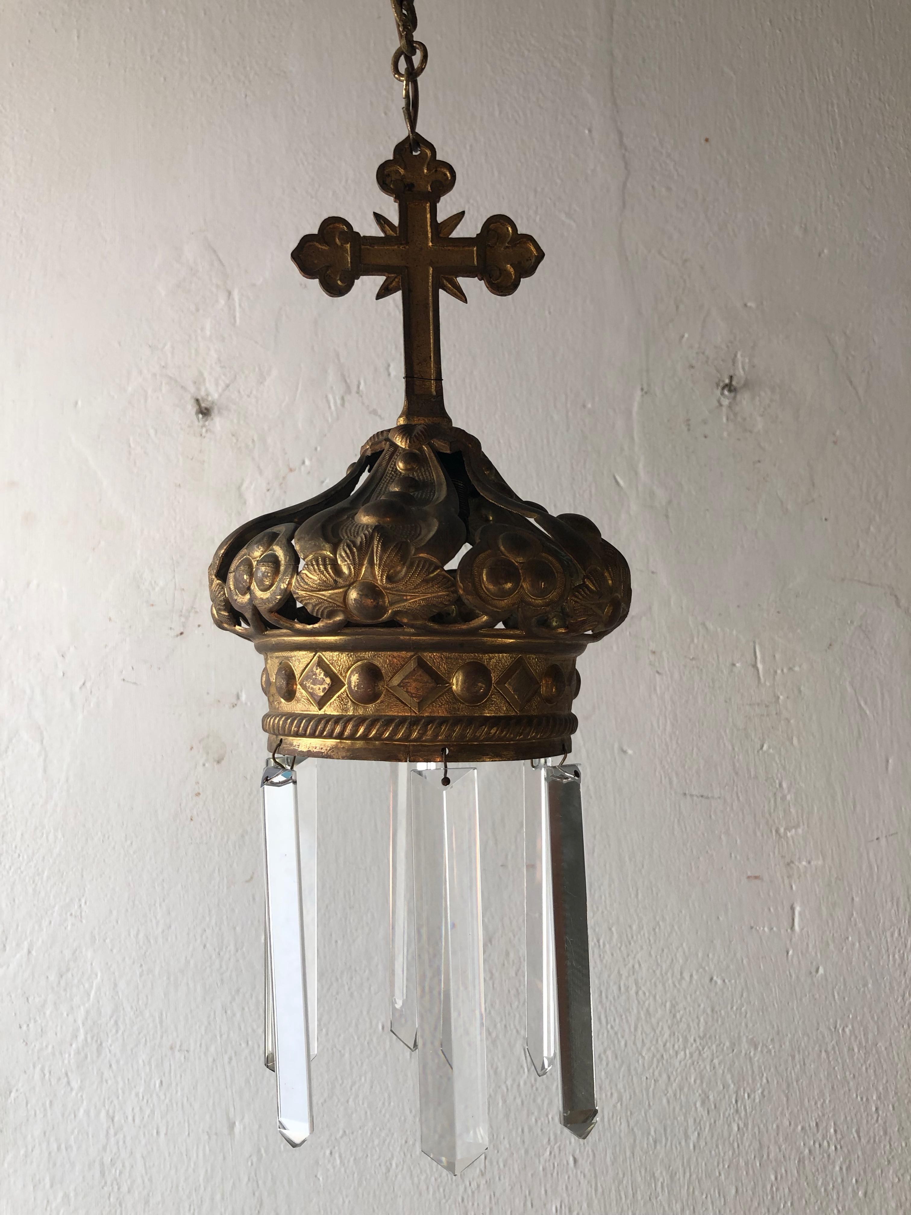 Will be re-wired with certified UL US sockets for the United States and appropriate sockets for other countries and ready to hang. Housing 1-light. Bronze cross on top of crown, dripping with long vintage crystal prisms. Adding another 12 inches of
